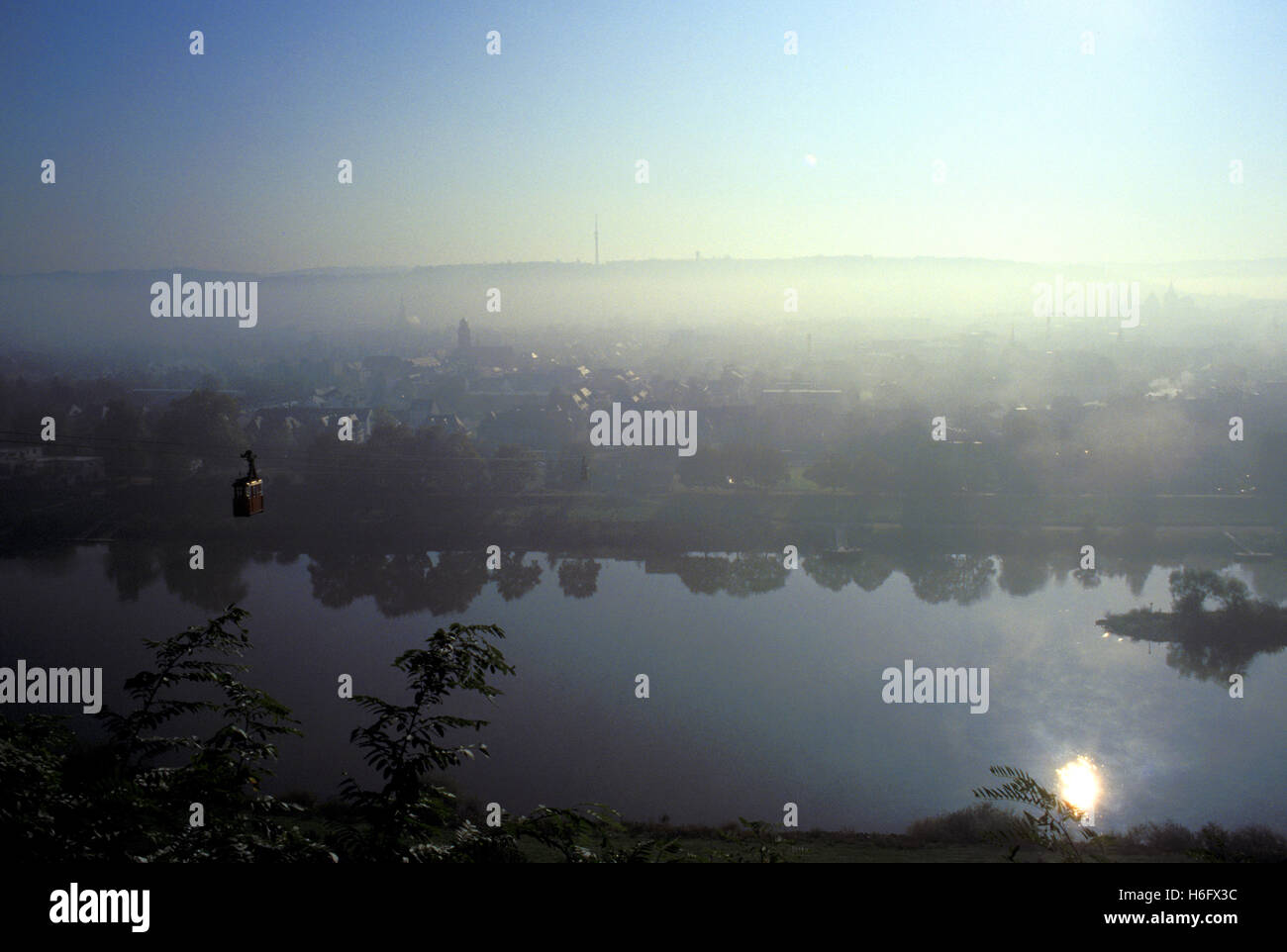 Germany, Trier, view from the Markus mountain to the city, early morning fog, river Moselle. Stock Photo