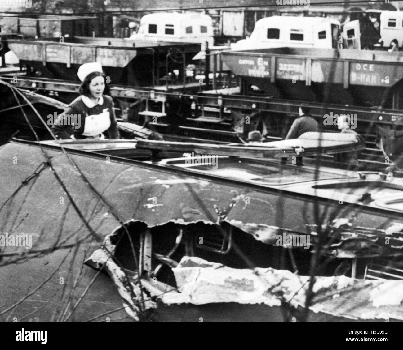 A nurse clambers over a wrecked coach during  rescue operations at Stechford railway station in Birmingham. Eight people were killed and 10 injured when a four-car passenger train was in collision with a Diesel locomotive. Stock Photo