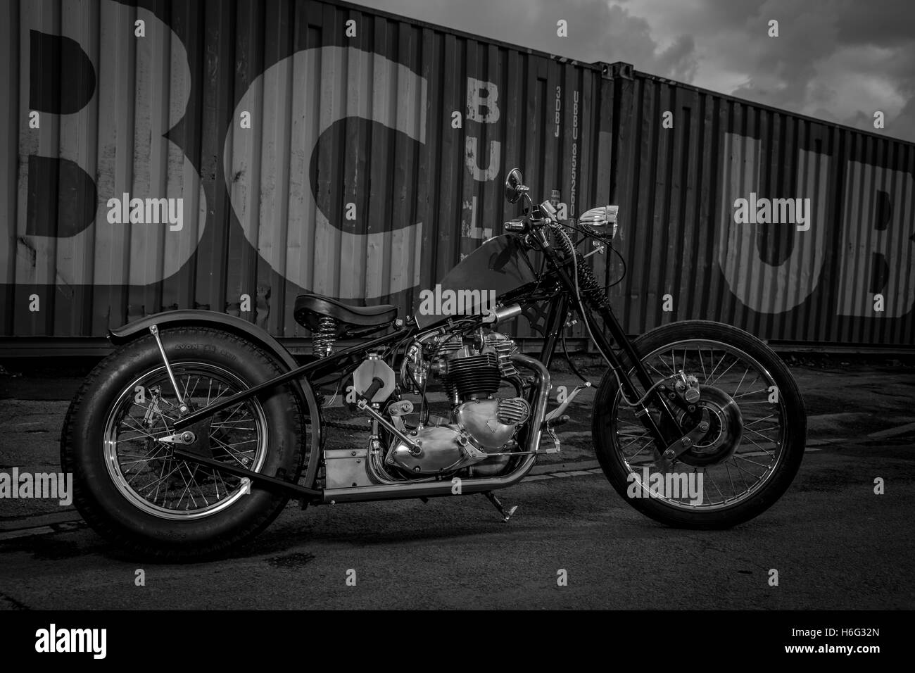 Kev's Self-built vintage motorcycle, one off Triumph Custom Chopper TR6. Photographed against industrial backdrop in Stockton-on-Tees. Stock Photo