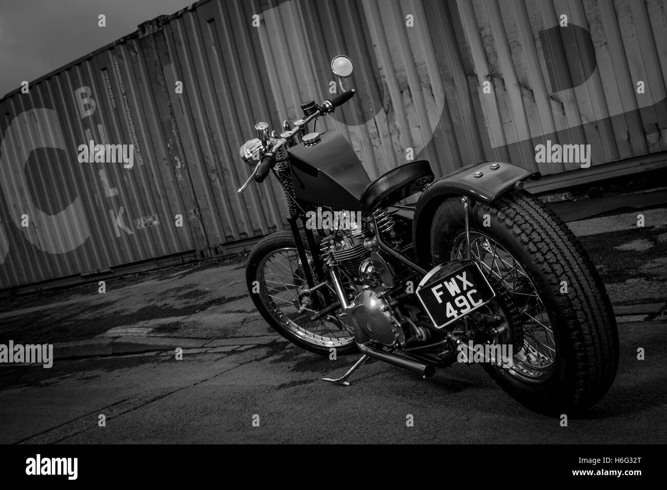 Kev's Self-built vintage motorcycle, one off Triumph Custom Chopper TR6. Photographed against industrial backdrop in Stockton-on-Tees. Stock Photo