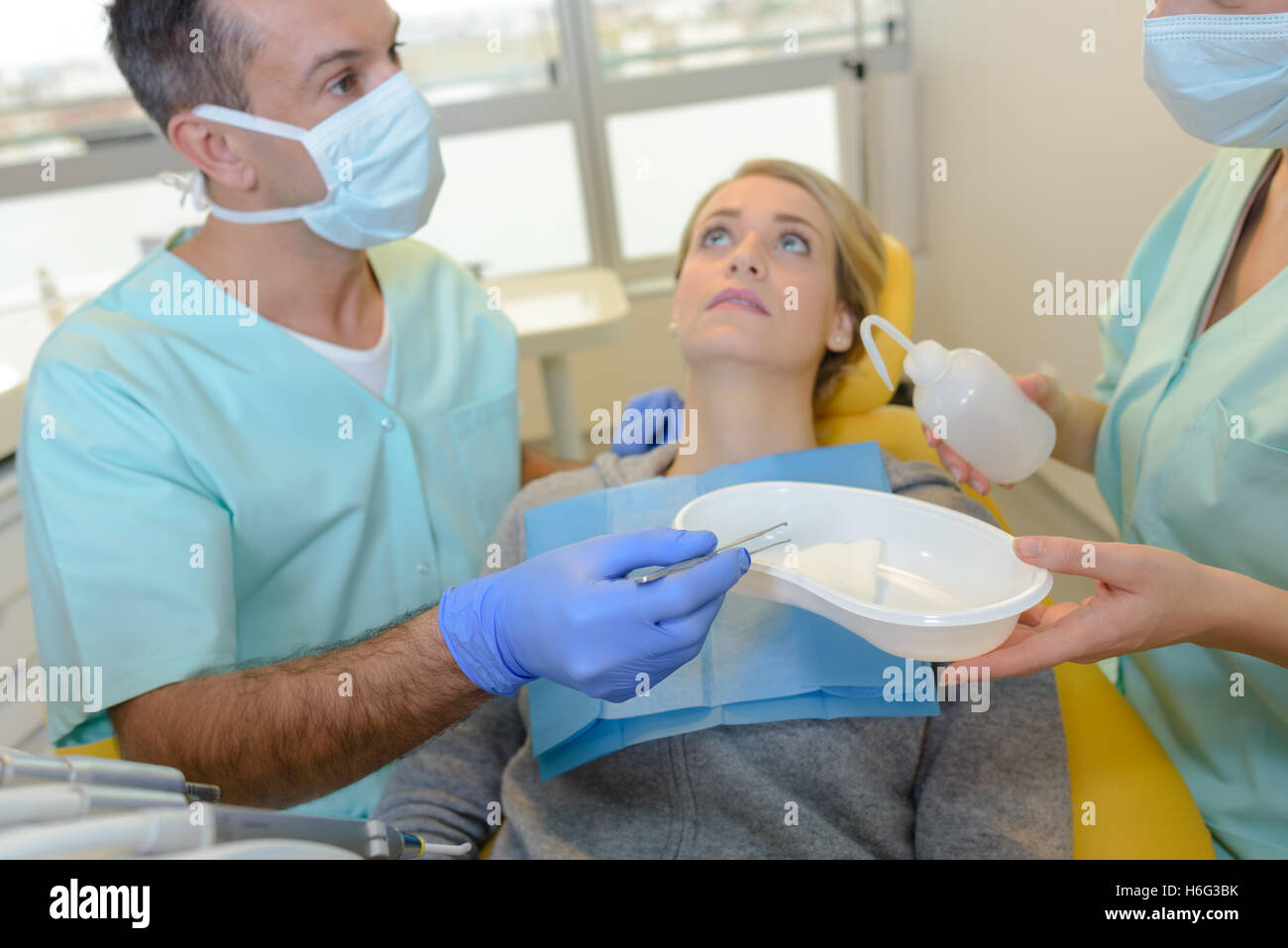 Nervous lady in dentist's chair Stock Photo