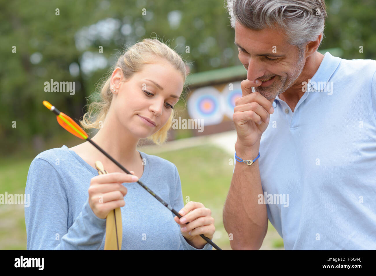 archers inspecting arrows Stock Photo