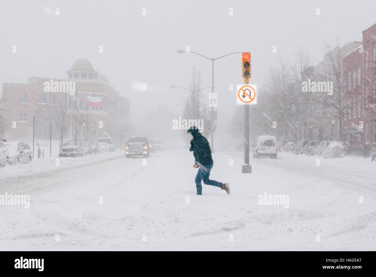 Man crossing city street during blizzard. Greenpoint Brooklyn. New York City/USA Stock Photo