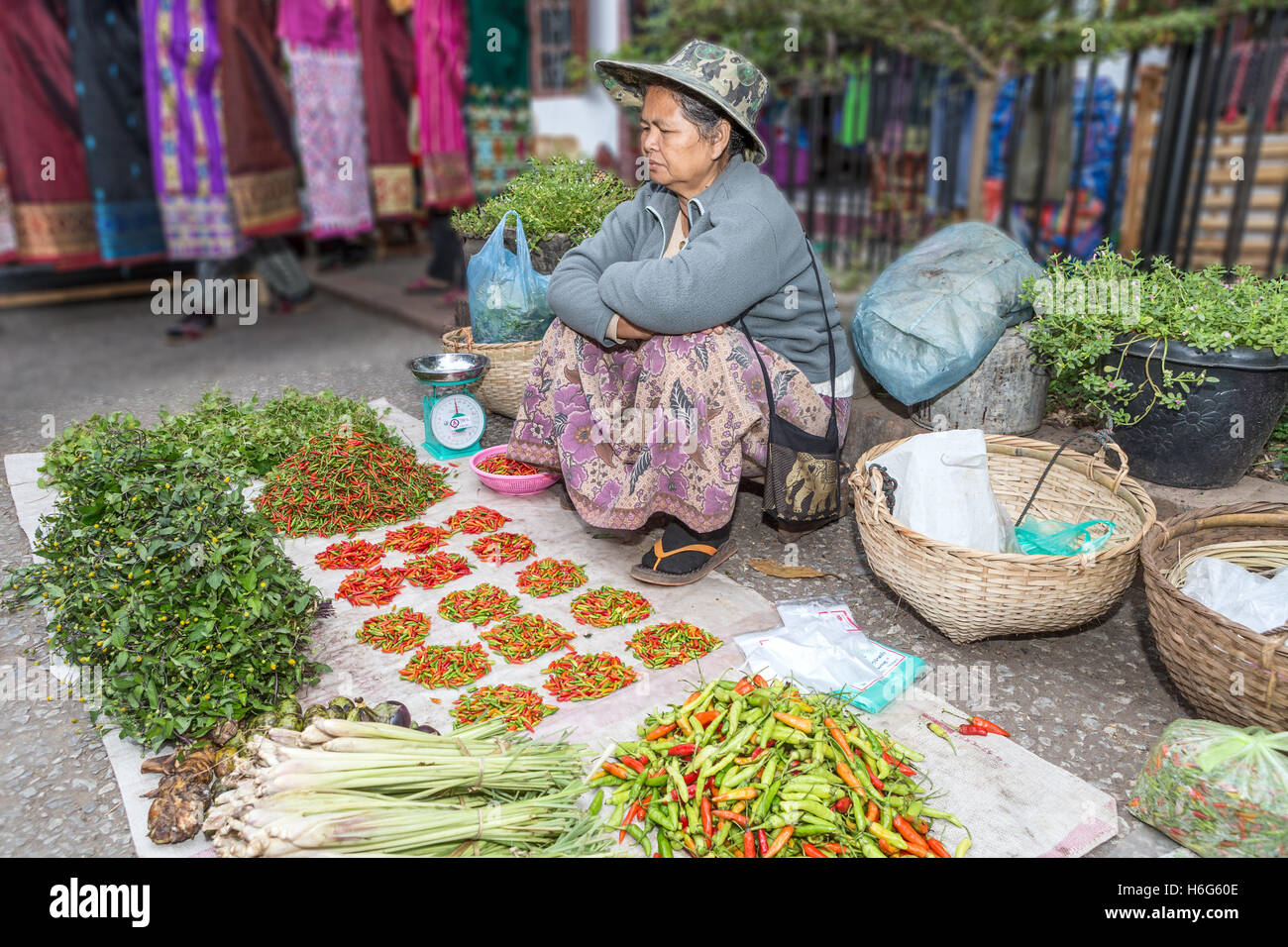Woman selling chillies hi-res stock photography and images - Alamy