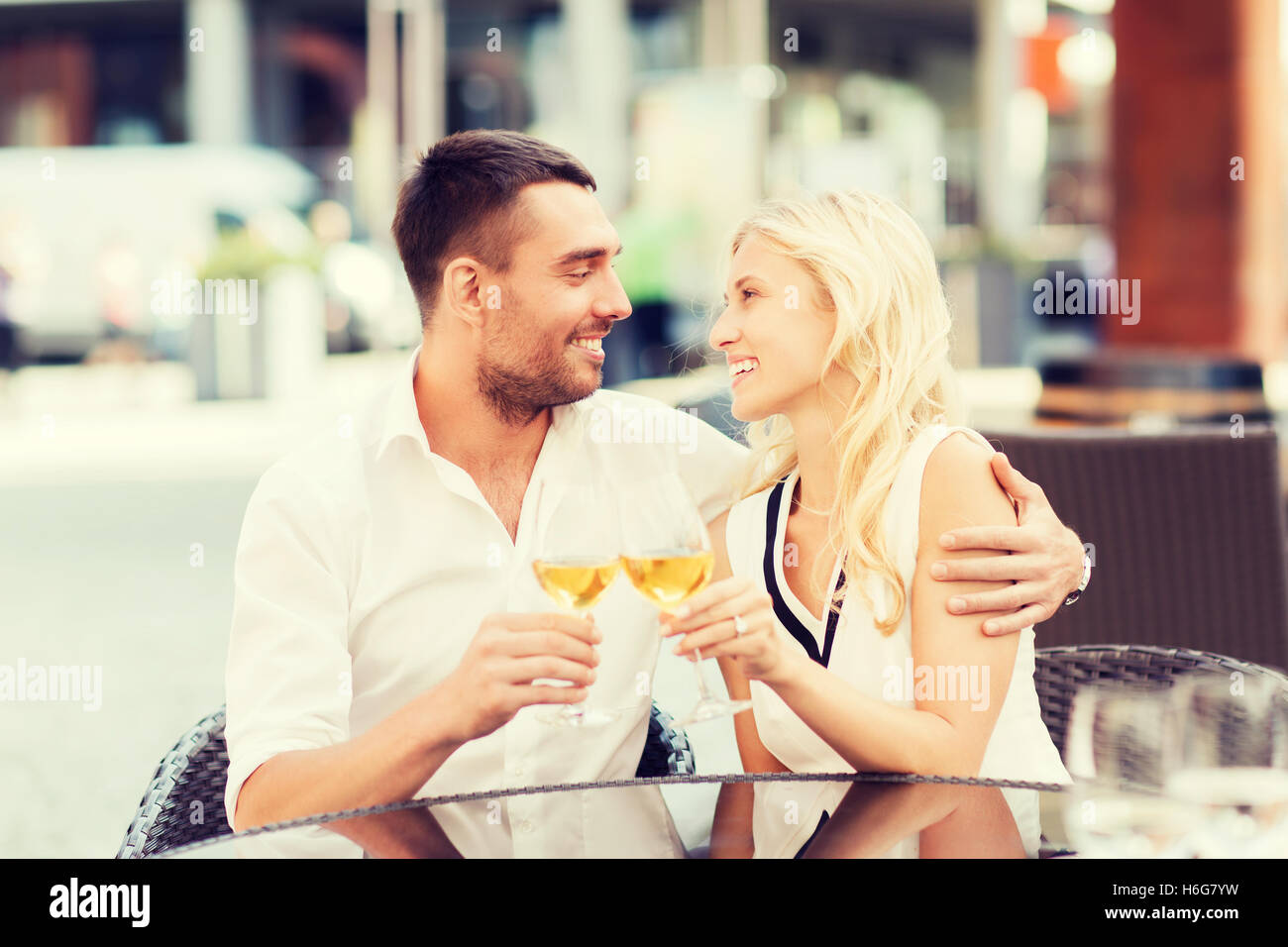 happy couple clinking glasses at restaurant lounge Stock Photo Alamy