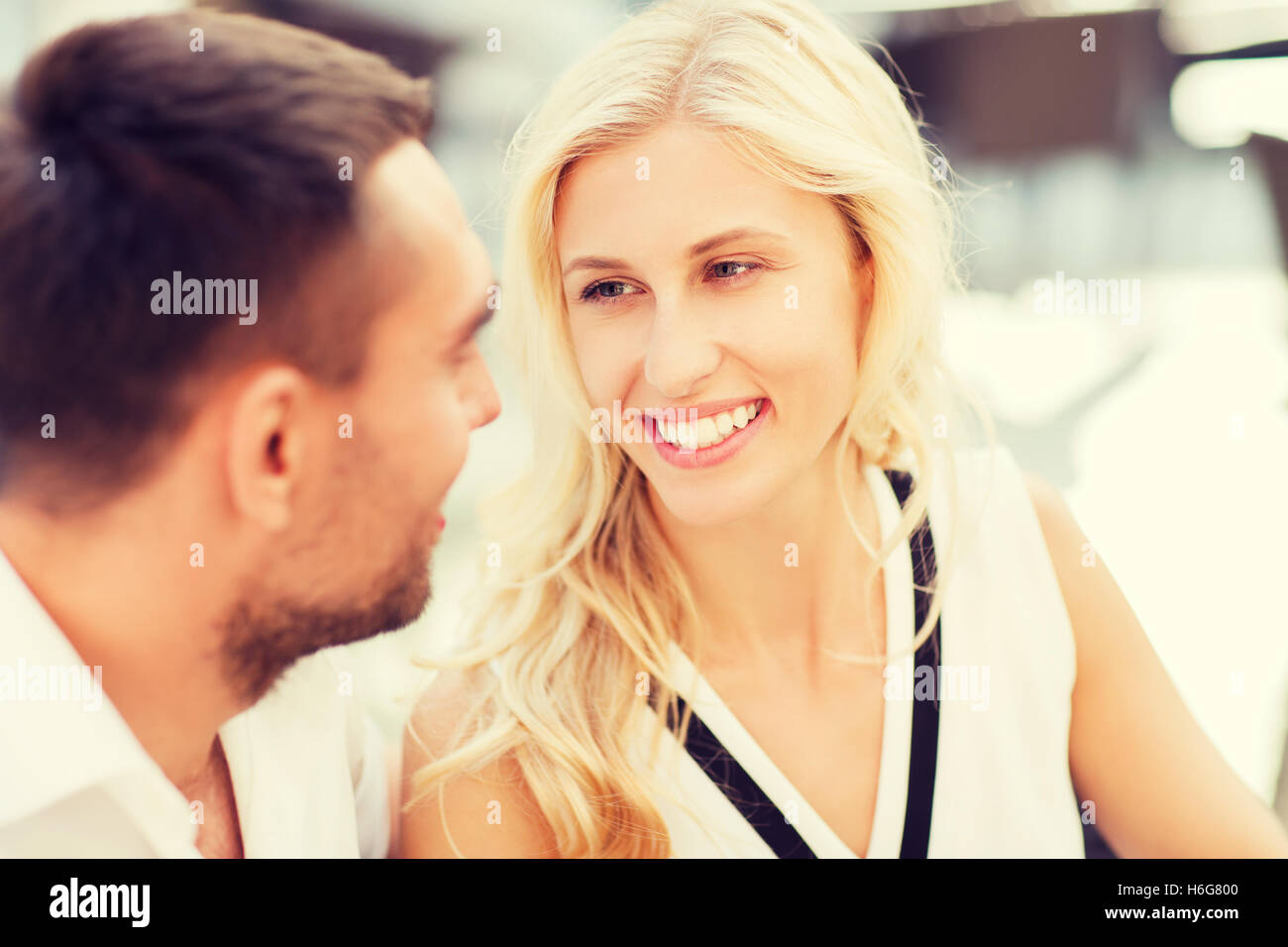 happy couple faces at restaurant Stock Photo