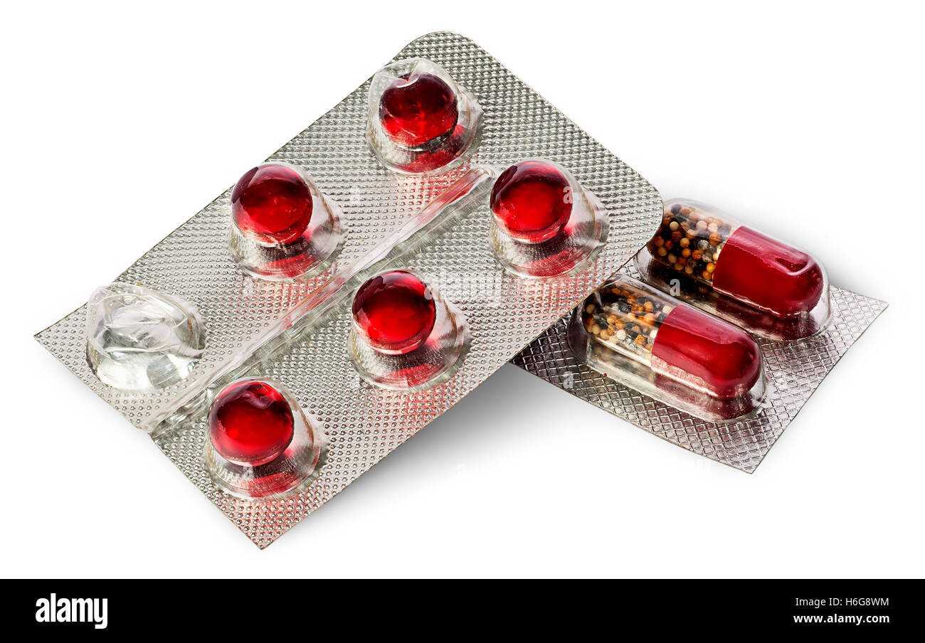 Pile of pills and capsules in package isolated on white background Stock Photo