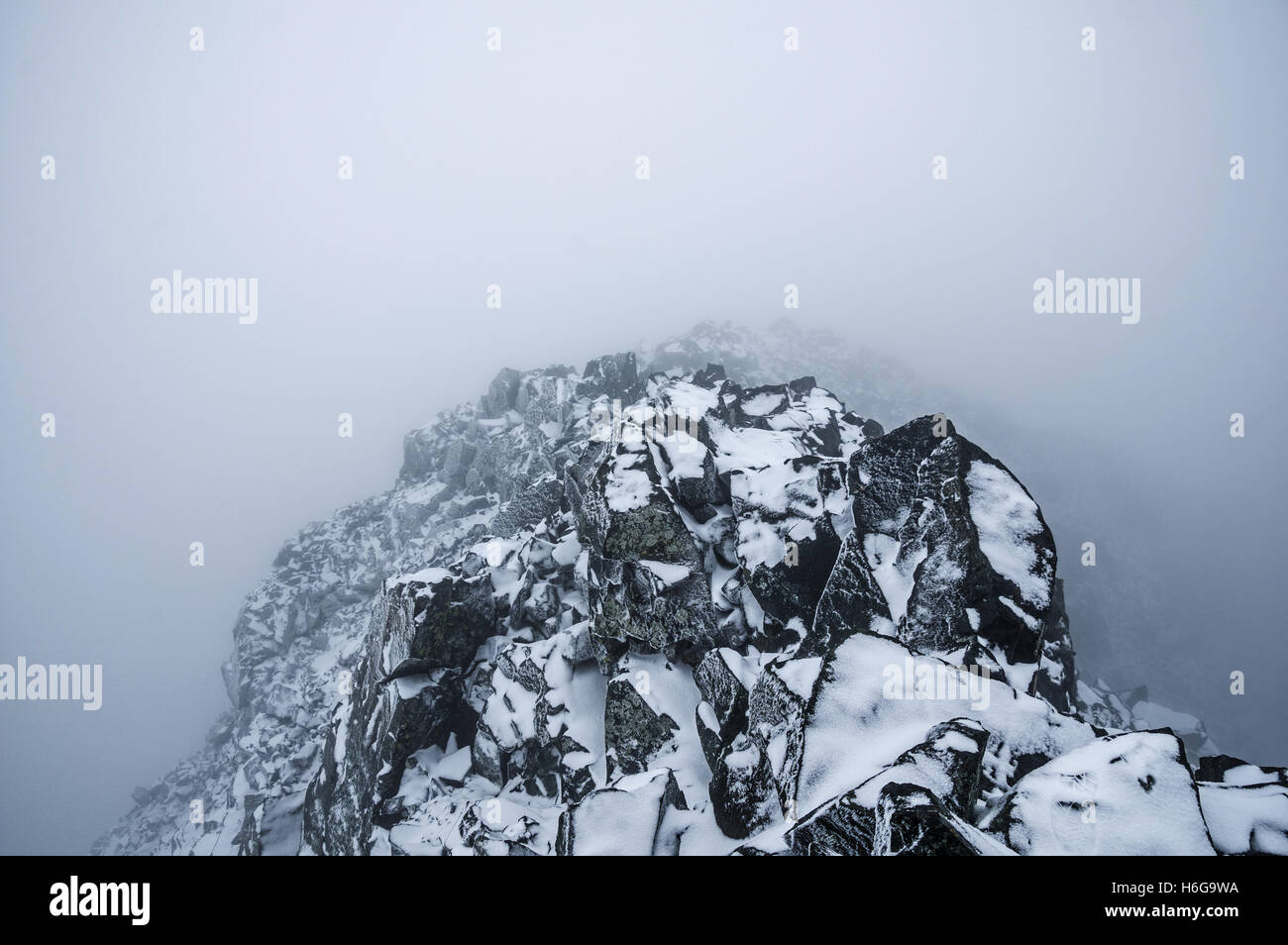 the summit of Blanca Peak in a whiteout storm with rime ice Stock Photo