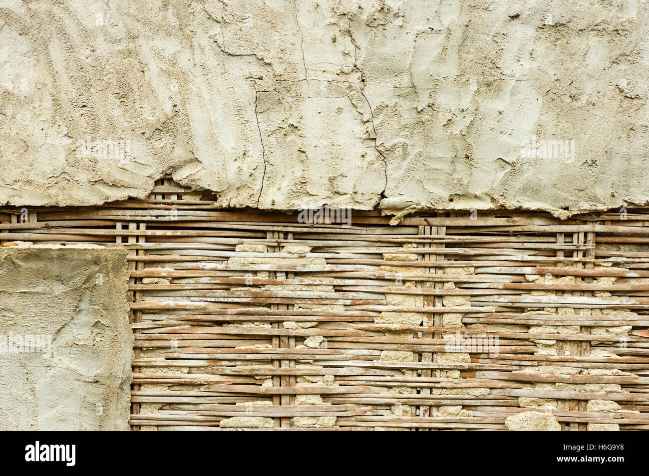 old bamboo lath and plaster wall falling apart Stock Photo