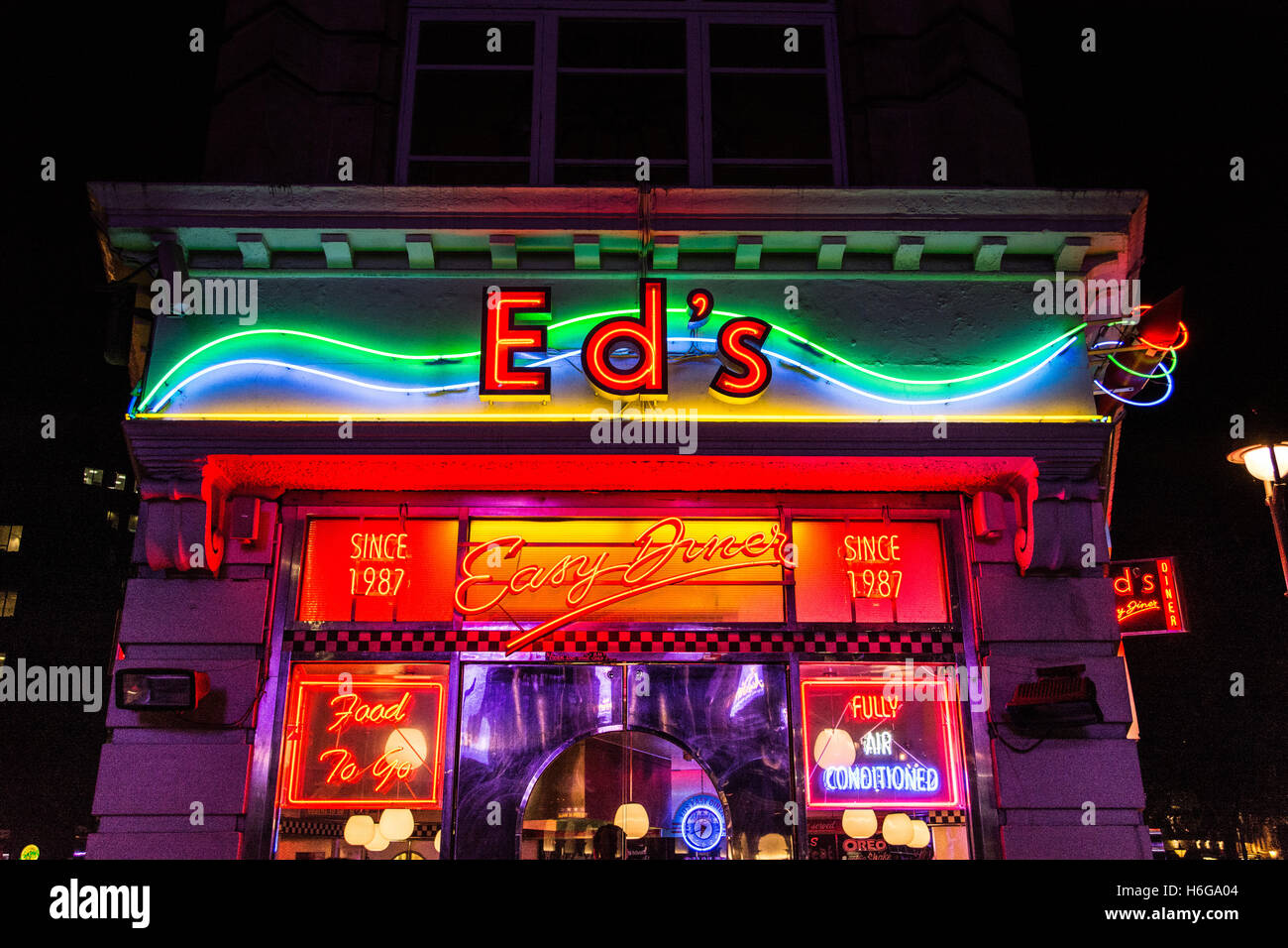 Night-time neon exterior of Ed's Diner, Old Compton Street, Soho, West End, London, England, UK Stock Photo