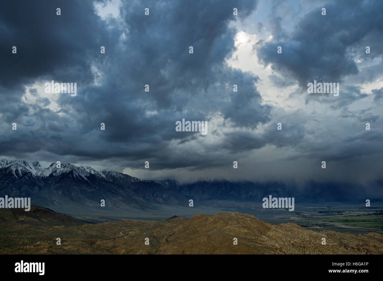 a spring storm comes in over the Eastern Sierra over the Owens Valley Stock Photo