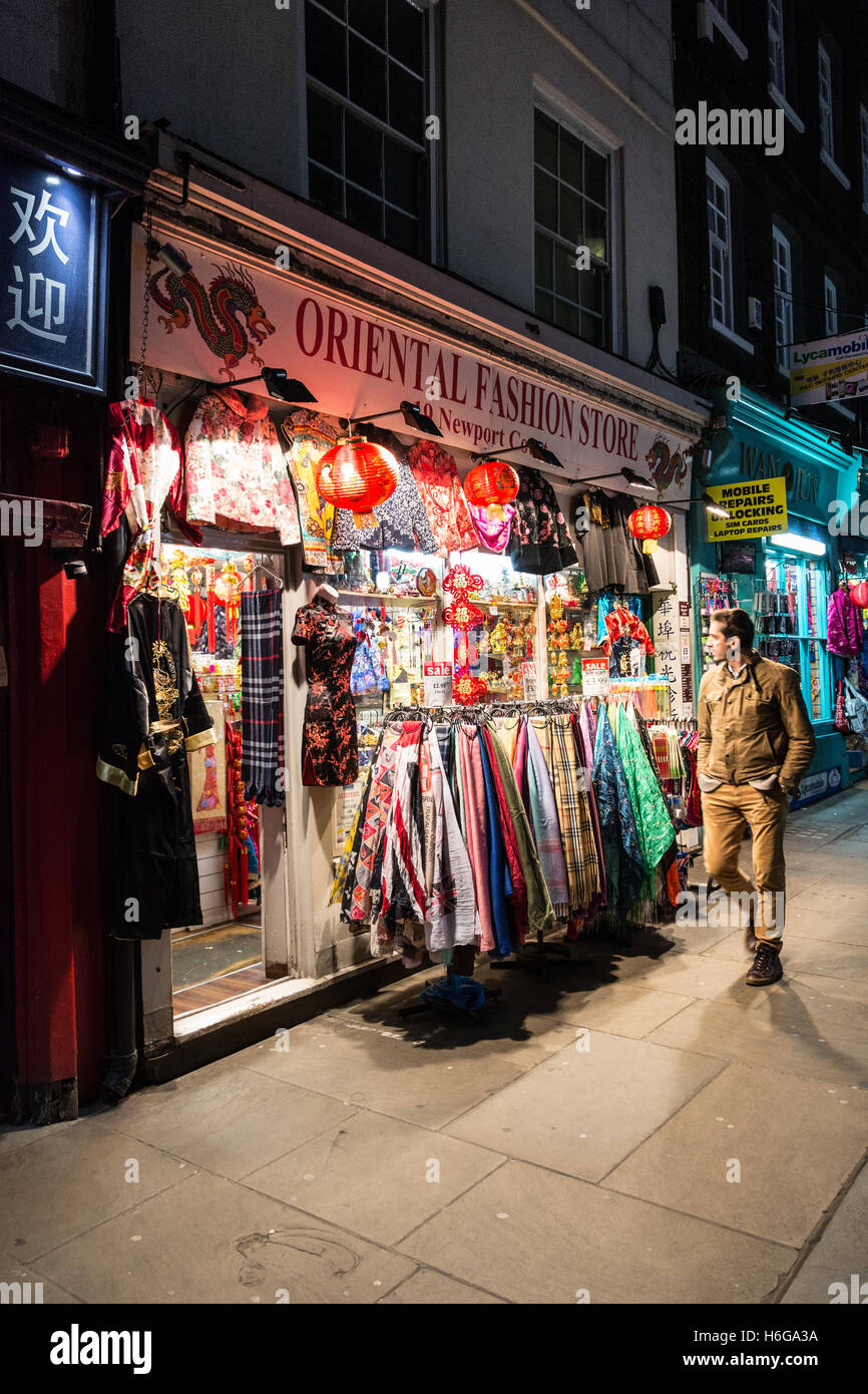 A man window shopping on a colourful Newport Court in London's Chinatown Stock Photo