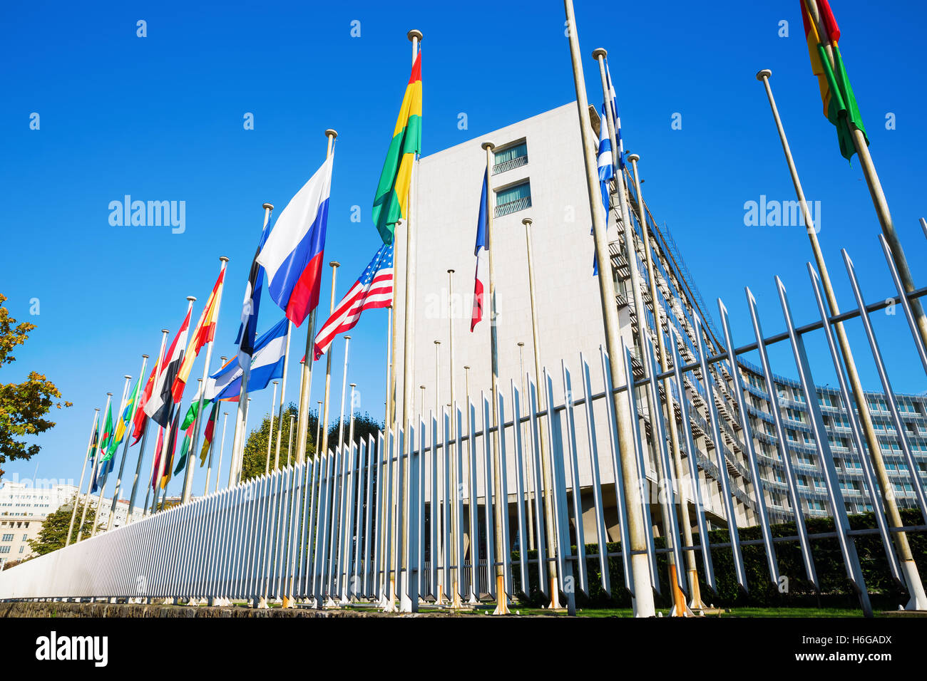 world flags in front of UNESCO headquarters in Paris, France Stock Photo