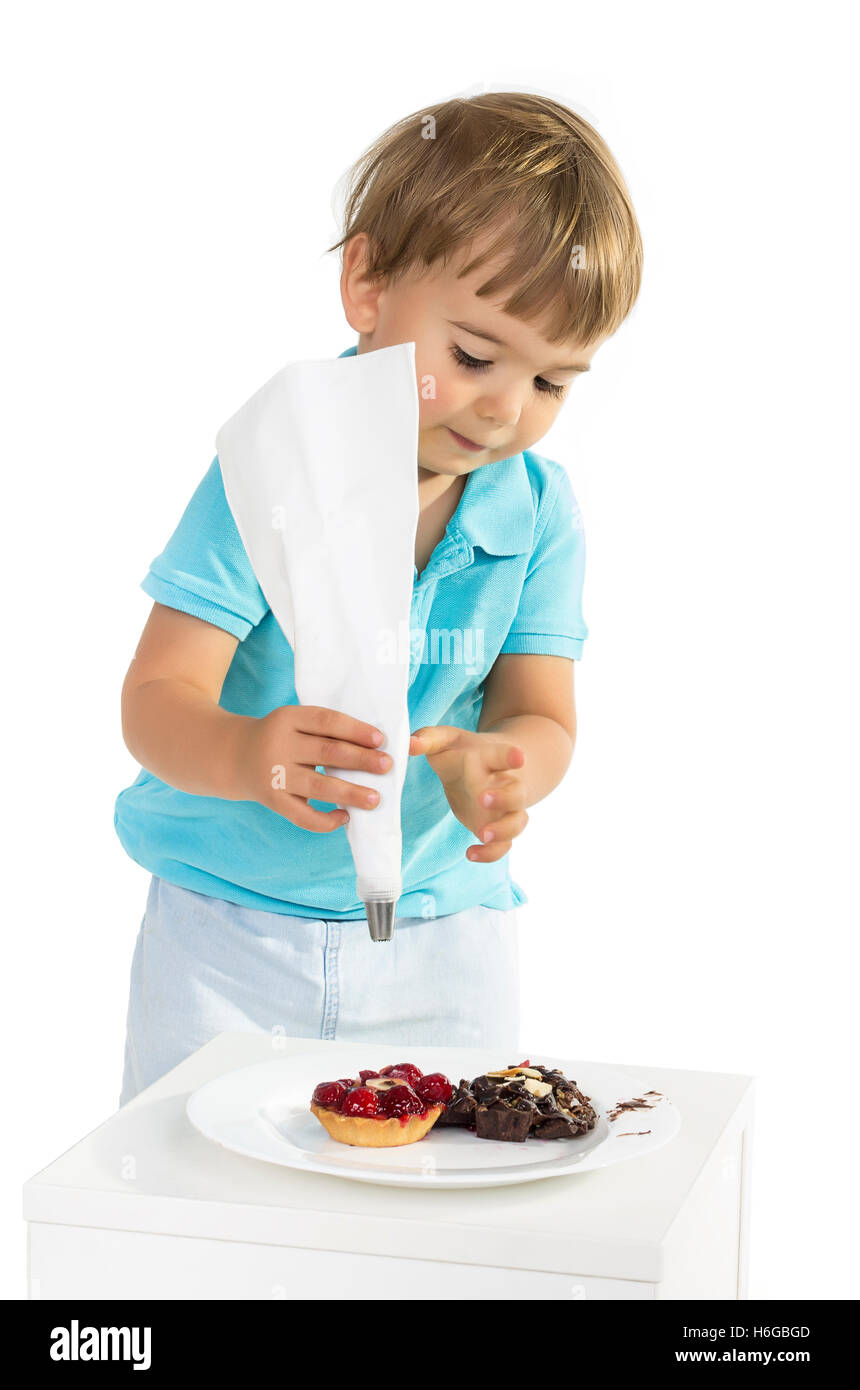 Two years boy learning cooking through play. Stock Photo
