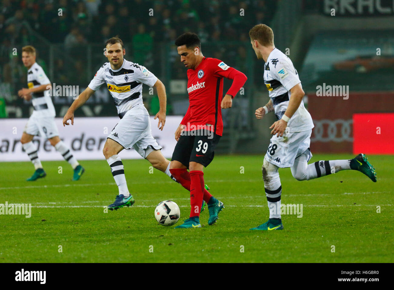 sports, football, Bundesliga, 2016/2017, Borussia Moenchengladbach versus Eintracht Frankfurt 0:0, Stadium Borussia Park, scene of the match, f.l.t.r. Nico Elvedi (MG) behind, Tony Jantschke (MG), Omar Mascarell (Frankfurt) in ball possession, Andre Hahn (MG) Stock Photo