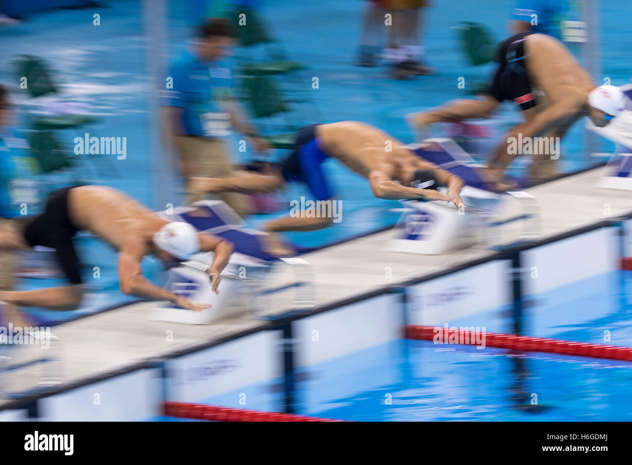 Start of men's swimming race Stock Photo - Alamy