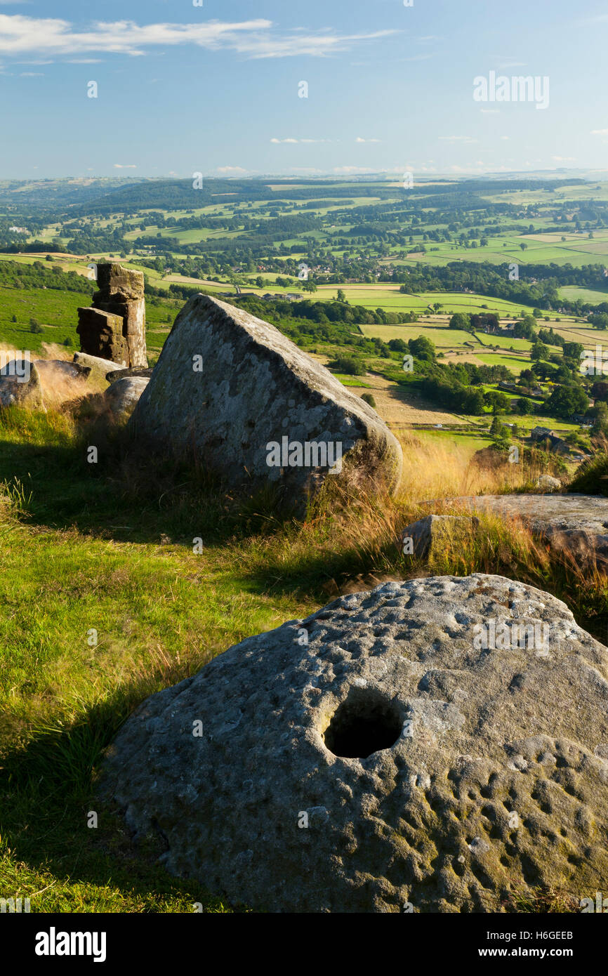 An adandoned grinding stone at Curbar Edge, Peak District, Derbyshire, England UK Stock Photo