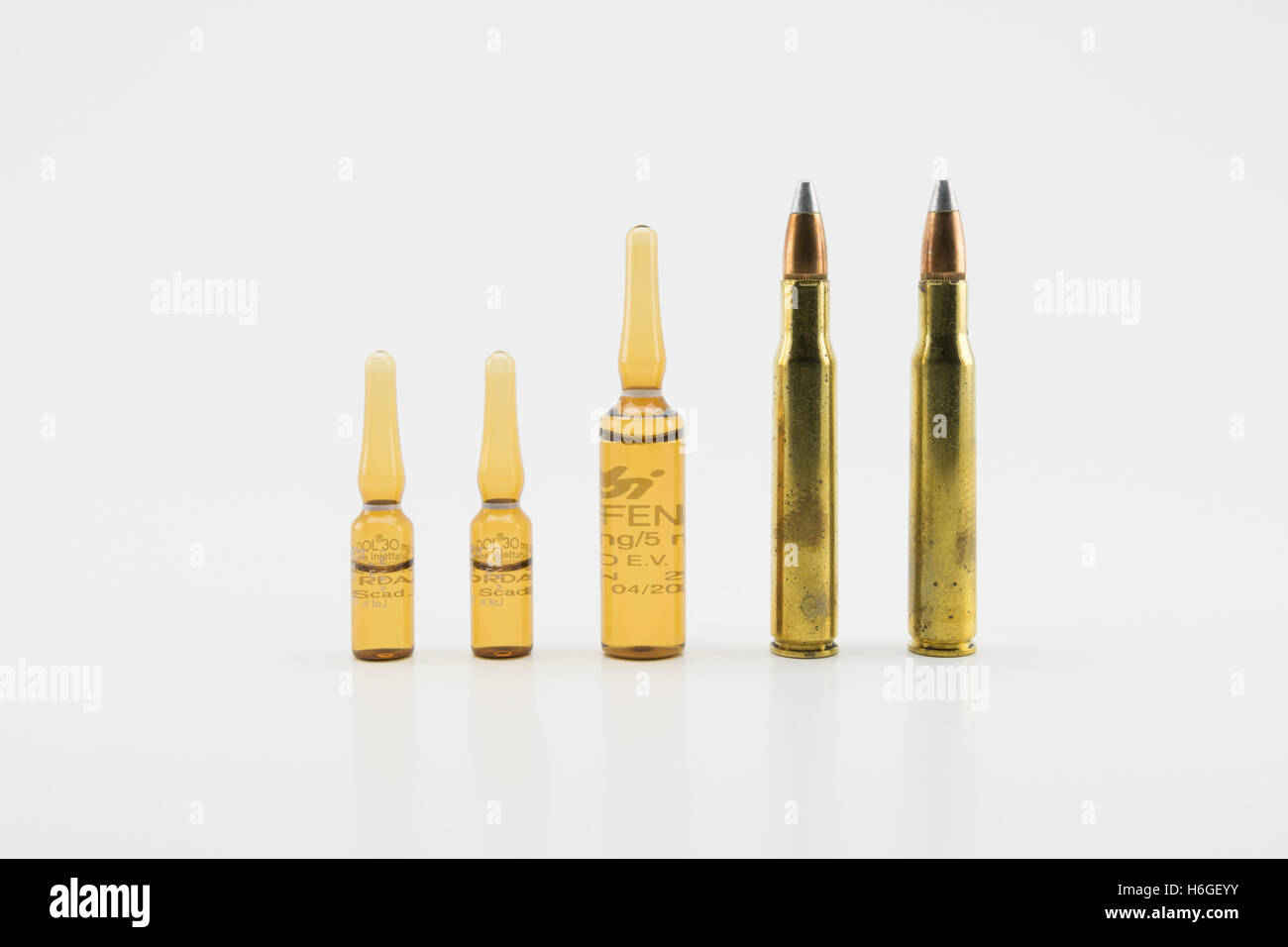 Verona, Italy - February 27, 2015: Composition with vials and bullets on white background Stock Photo