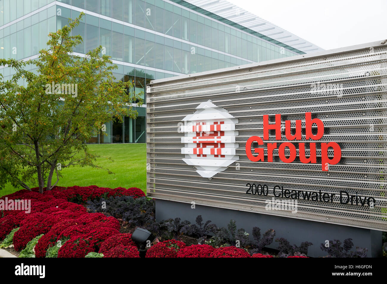 A logo sign outside of the headquarters of The Hub Group in Oak Brook