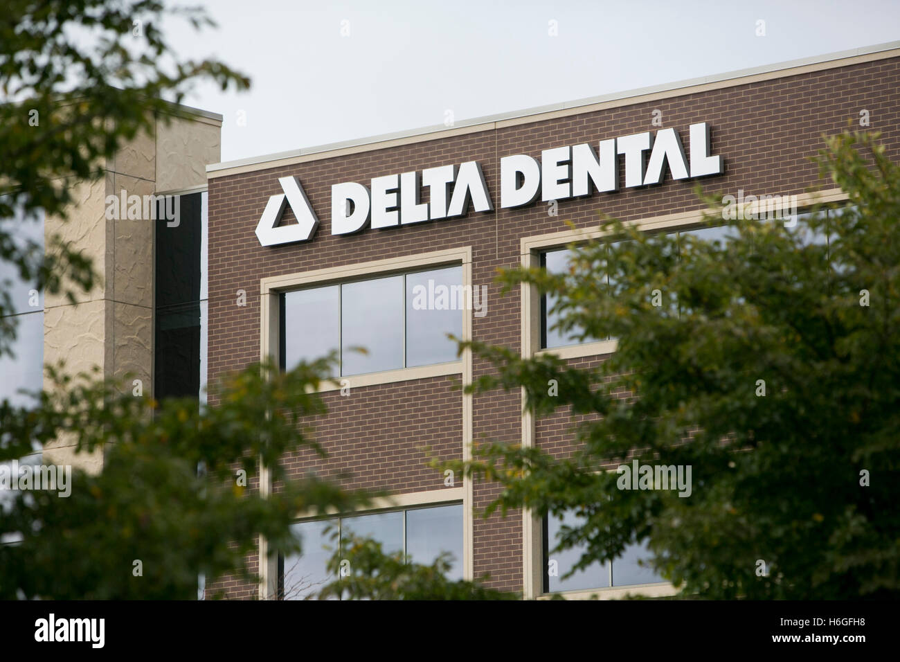 A logo sign outside of a facility occupied by Delta Dental in Warrenville, Illinois on October 15, 2016. Stock Photo