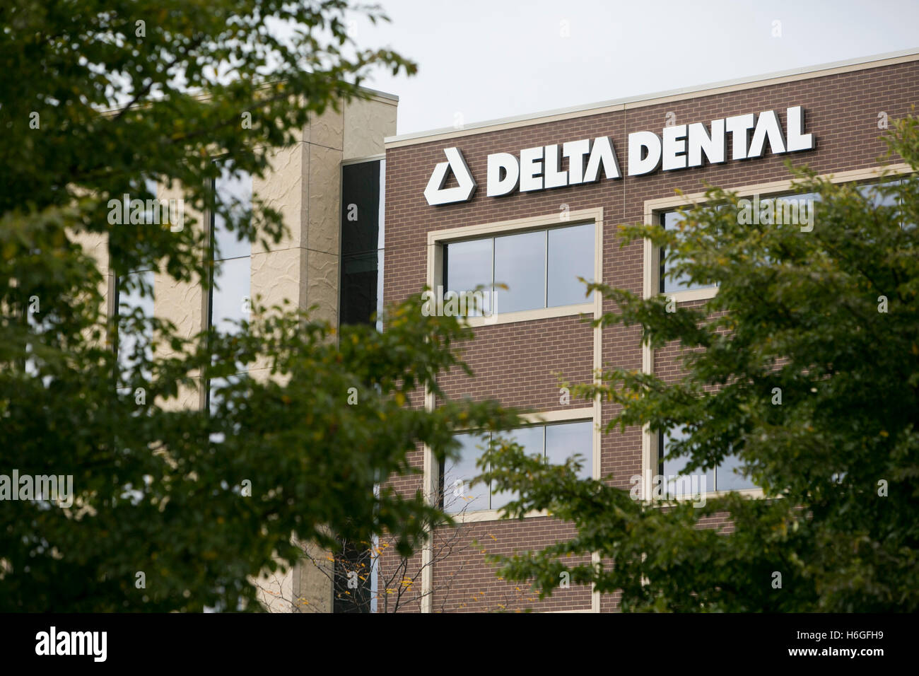 A logo sign outside of a facility occupied by Delta Dental in Warrenville, Illinois on October 15, 2016. Stock Photo