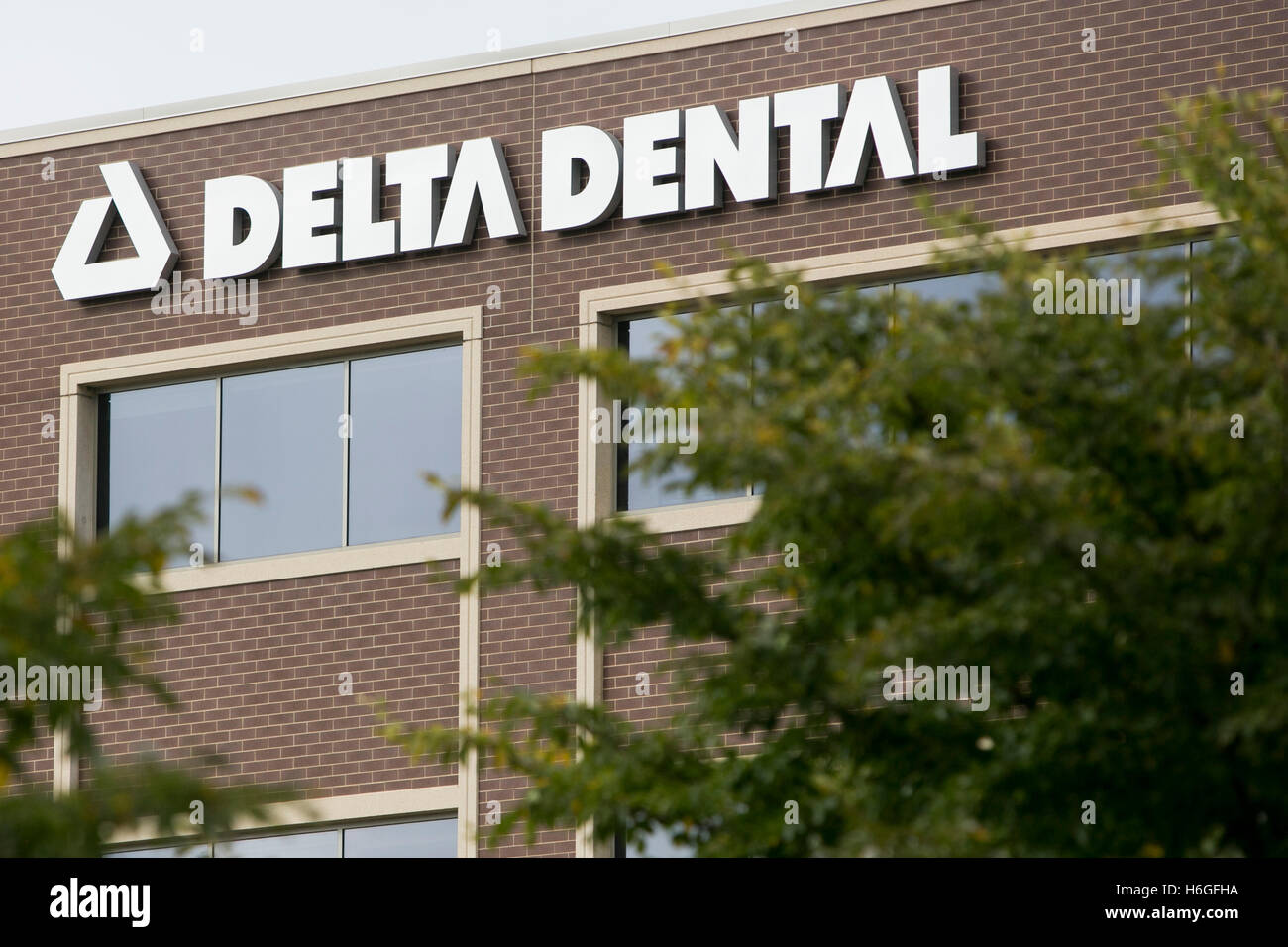 A logo sign outside of a facility occupied by Delta Dental in Warrenville, Illinois on October 15, 2016. Stock Photo