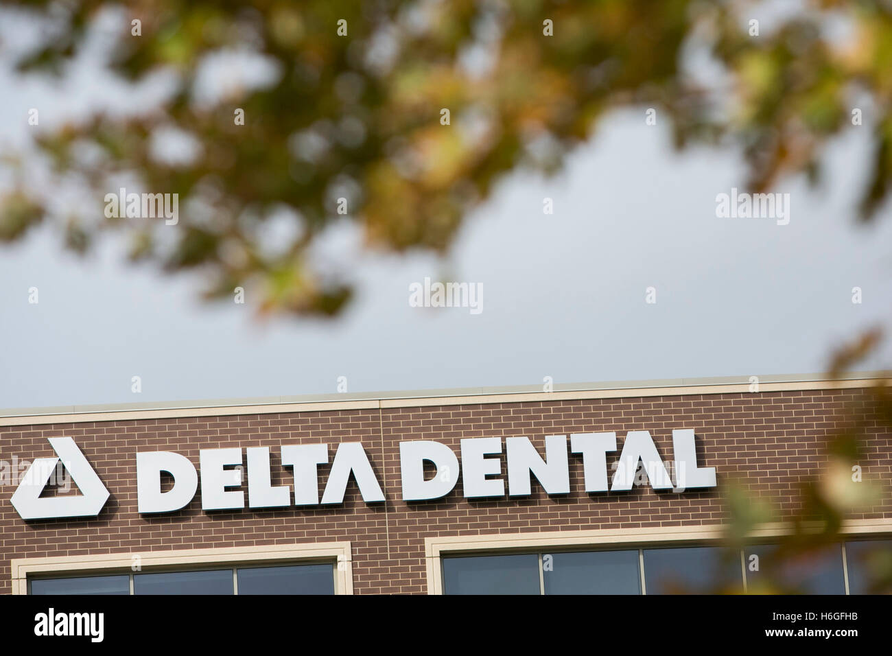 A logo sign outside of a facility occupied by Delta Dental in Warrenville, Illinois on October 15, 2016. Stock Photo