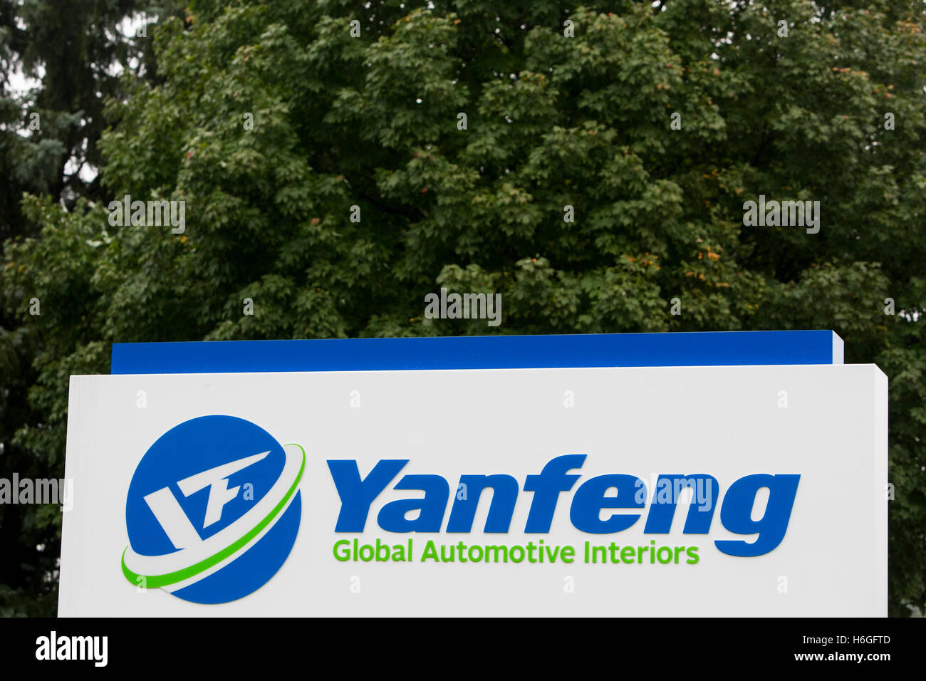 A logo sign outside of a facility occupied by Yanfeng Automotive in