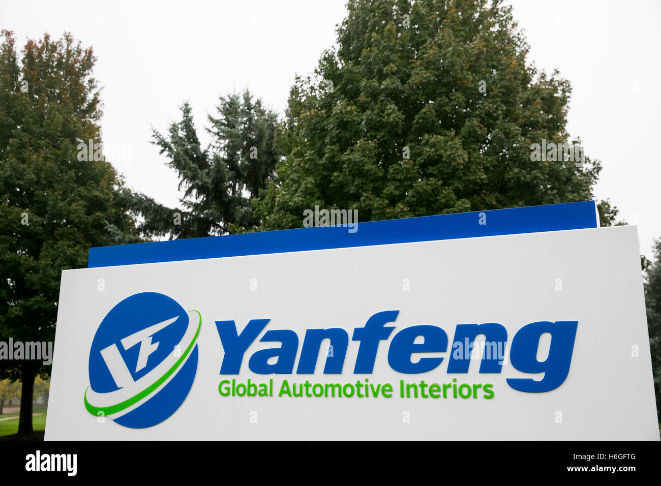 A logo sign outside of a facility occupied by Yanfeng Automotive in