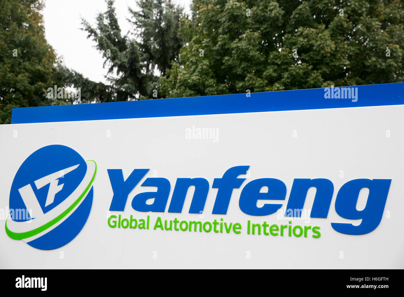 A logo sign outside of a facility occupied by Yanfeng Automotive in Holland, Michigan on October 16, 2016. Stock Photo