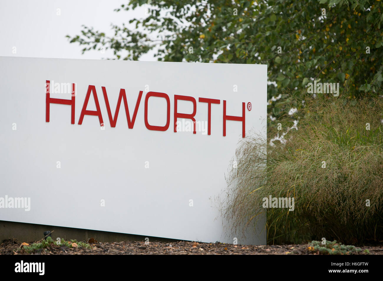 A logo sign outside of the headquarters of Haworth Inc., in Holland