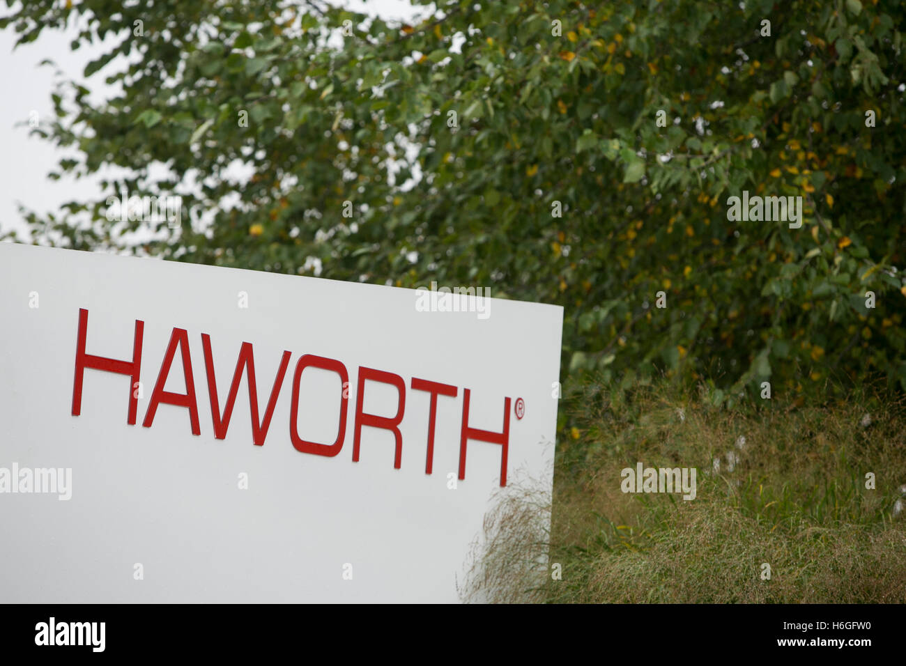 A logo sign outside of the headquarters of Haworth Inc., in Holland