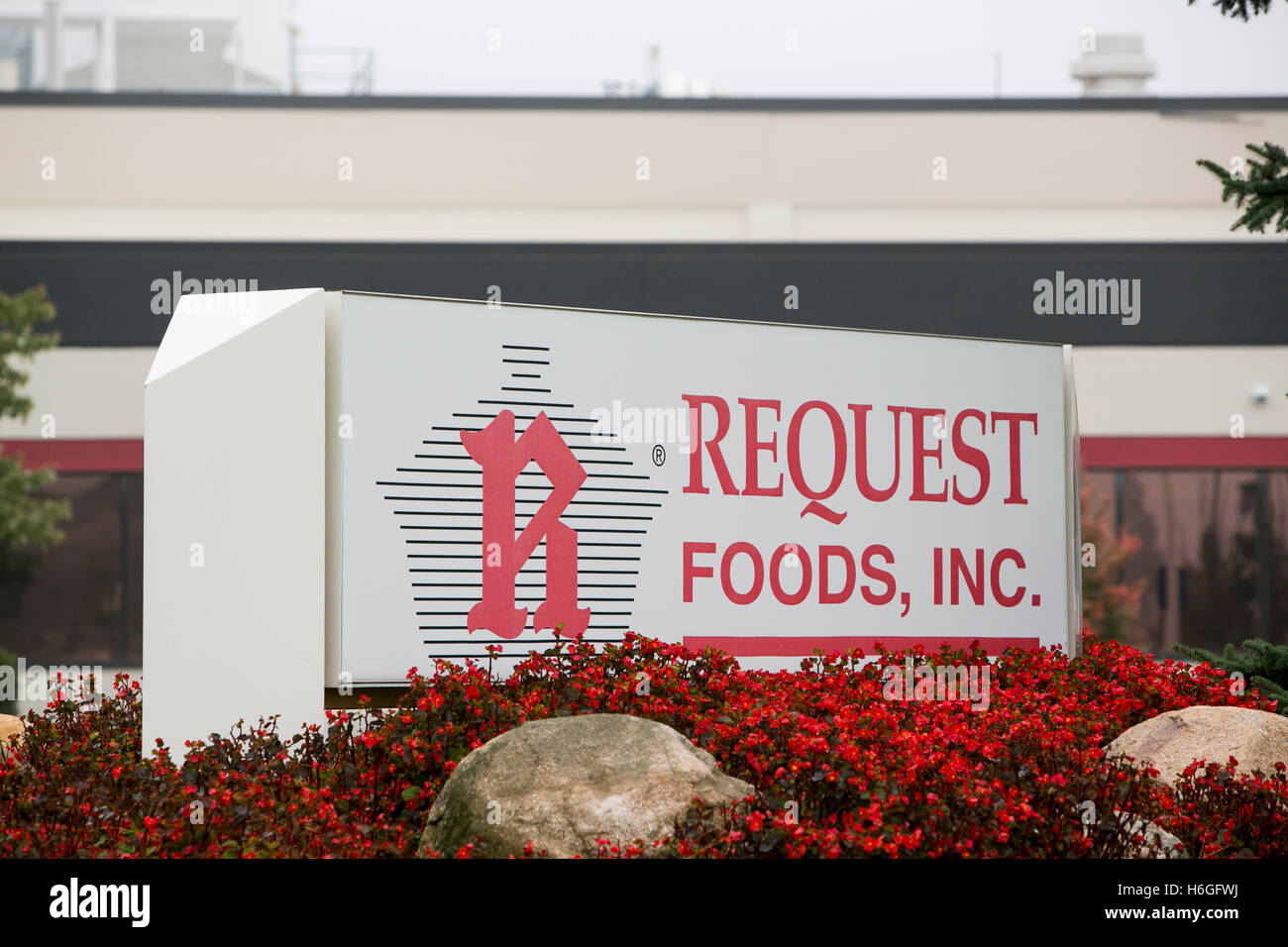 A logo sign outside of the headquarters of Request Foods, Inc., in Holland, Michigan on October 16, 2016. Stock Photo