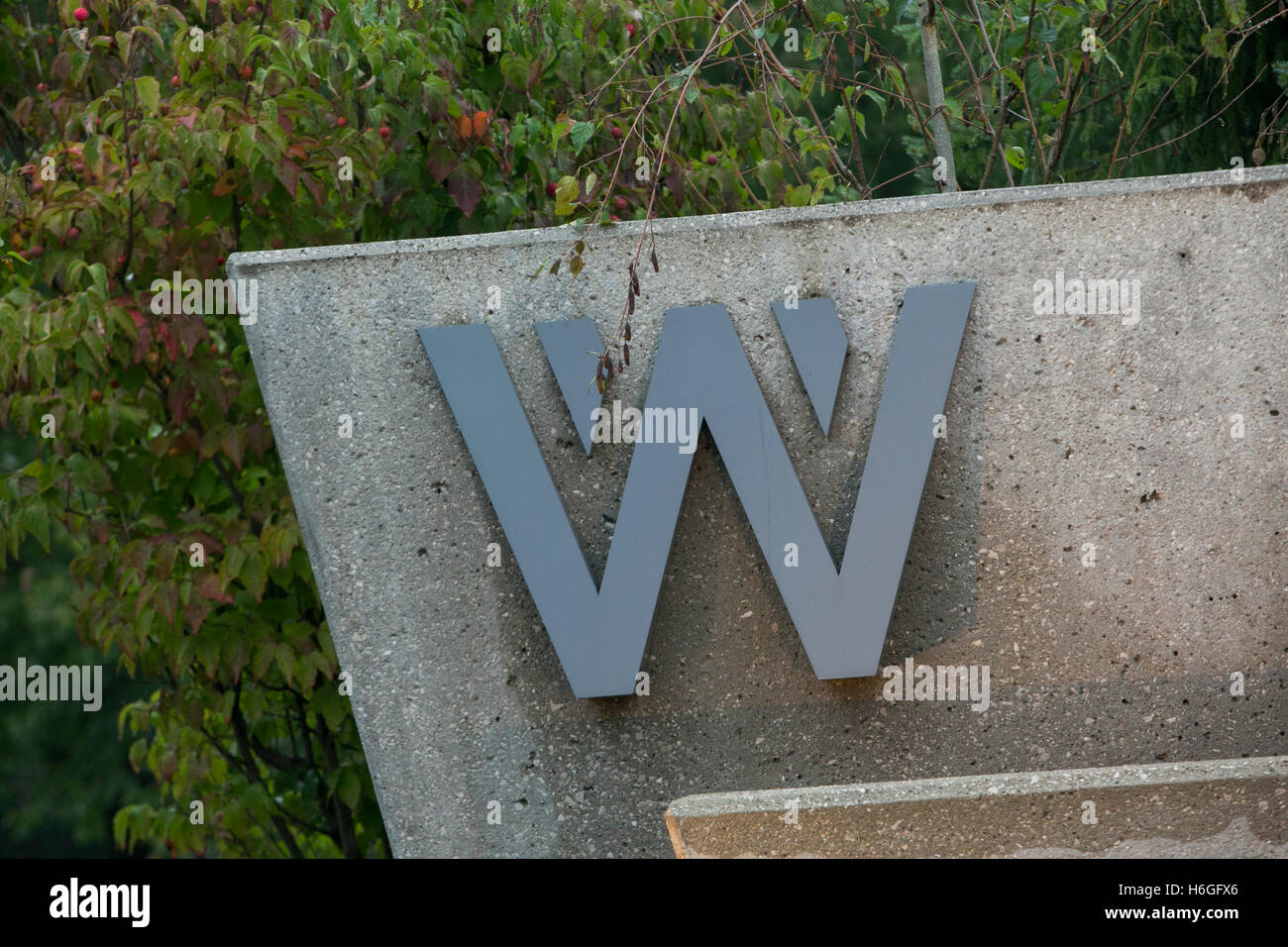 A logo sign outside of the headquarters of Wolverine Worldwide in
