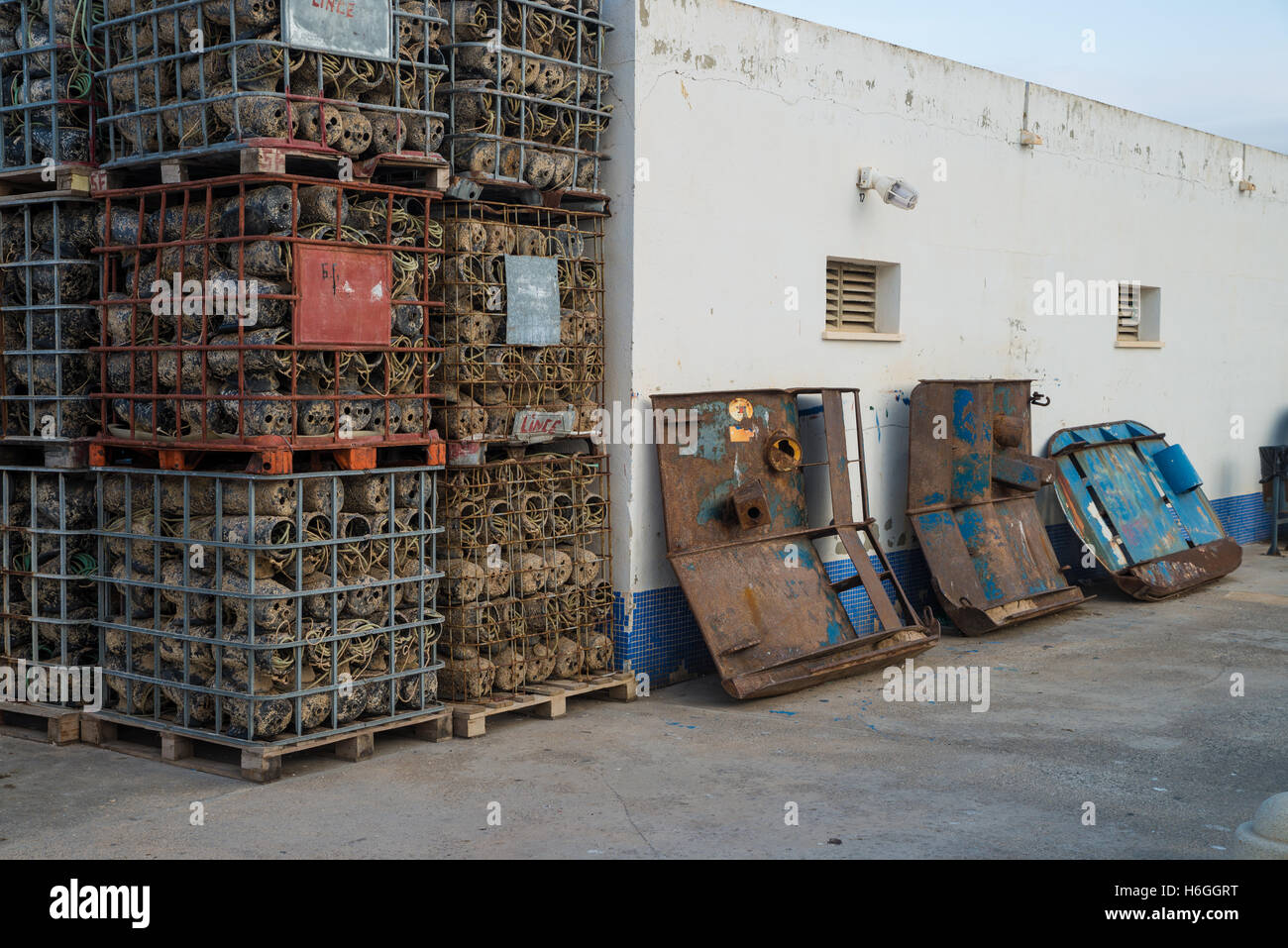 Fish Collection Lifter Stack Machine Fish farming equipment stacked on a harbor quay Stock Photo - Alamy