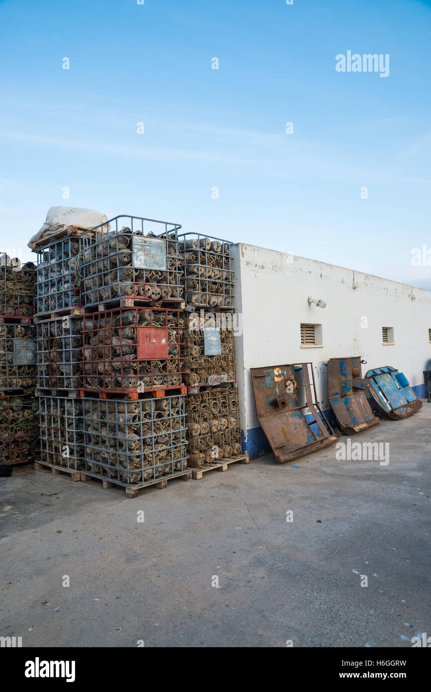 Fish Collection Lifter Stack Machine Fish farming equipment stacked on a harbor quay Stock Photo - Alamy