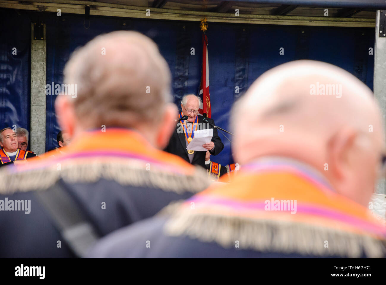 Members of the Orange Order listen to an address from a senior member