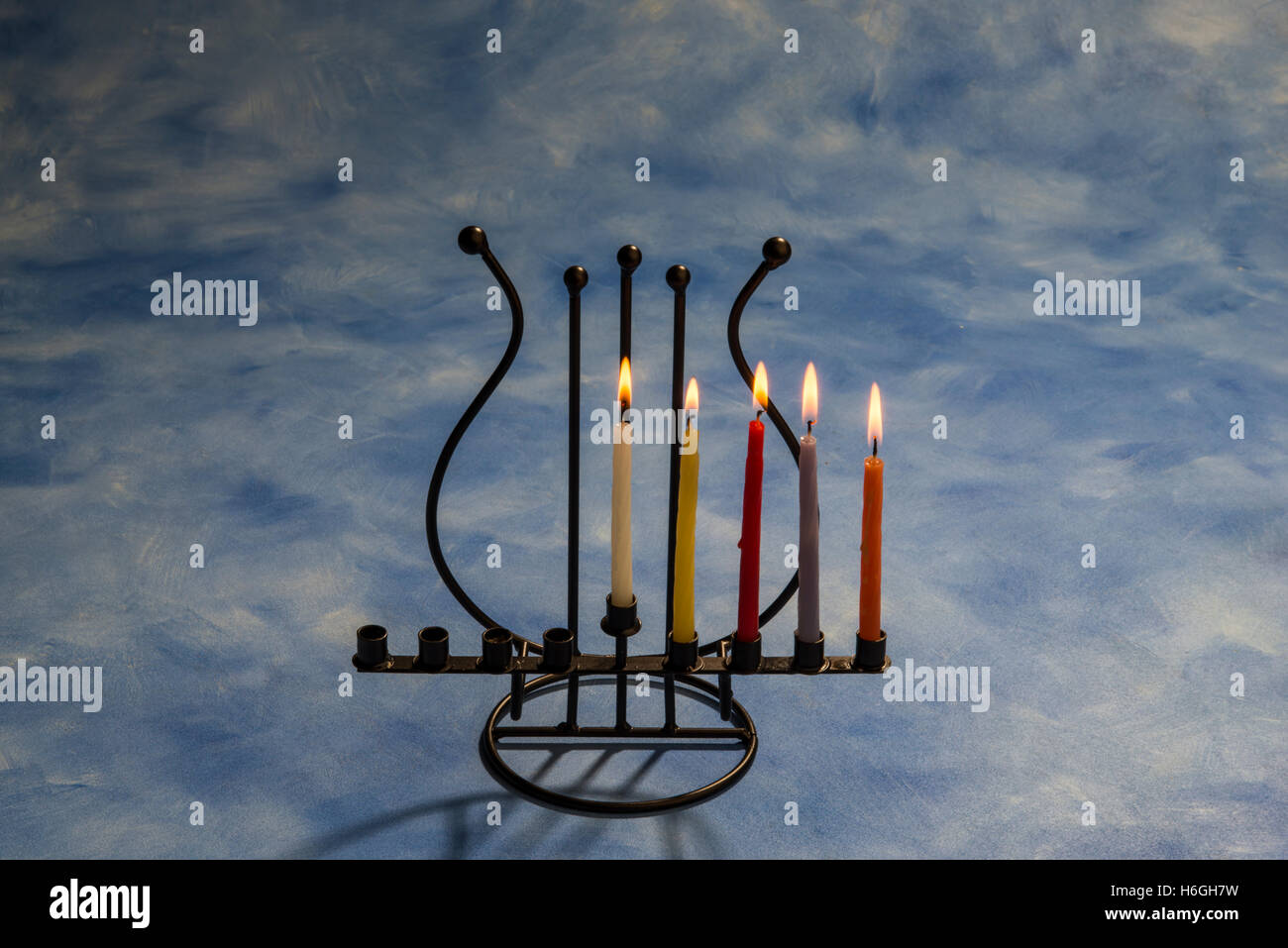 Fourth day of Hanukkah with burning Hanukkah candles in Menorah Stock