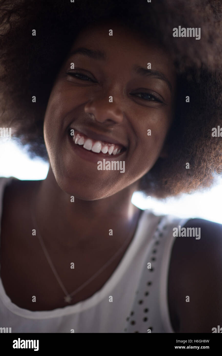 Close up portrait of a beautiful young african american woman smiling ...