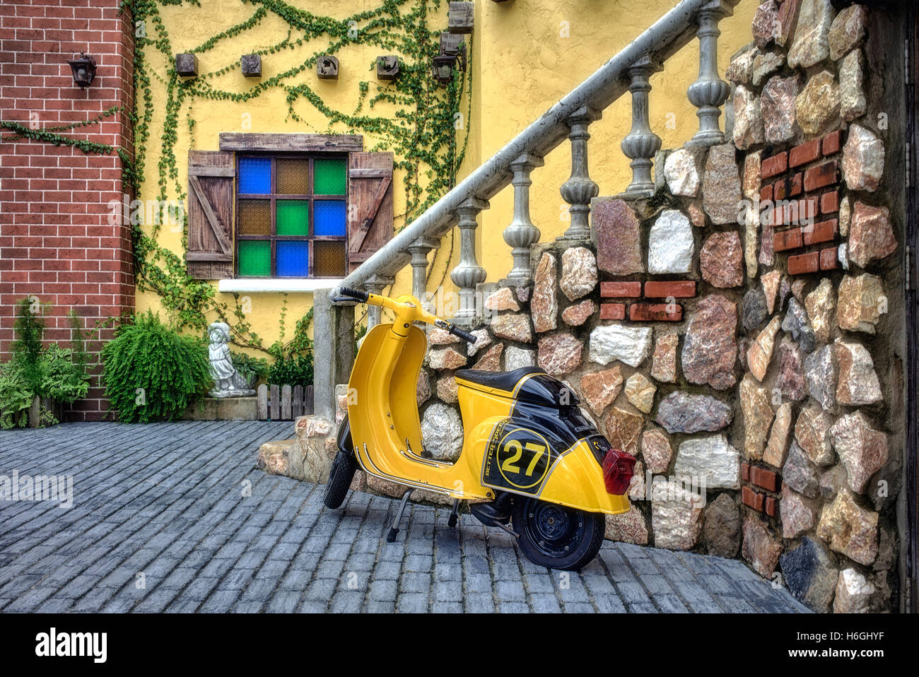 vintage Vespa scooter parked in an Italian forecourt. Italy Europe Stock Photo