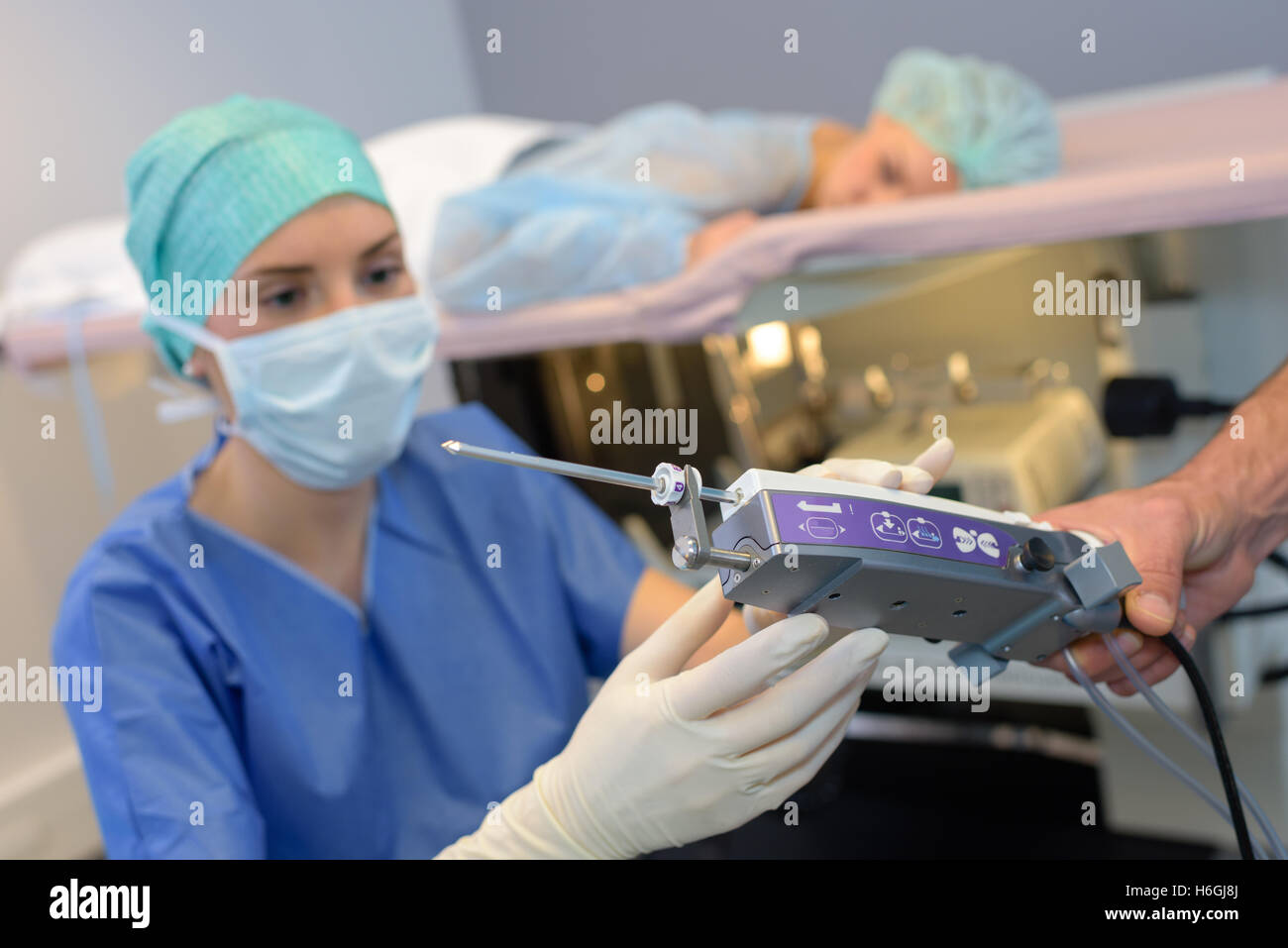 Nurse preparing equipment for medical procedure Stock Photo