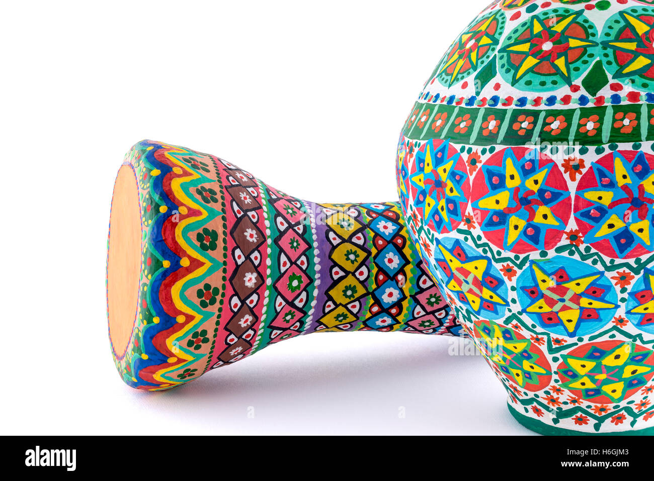 Two pieces of colorful painted potteries, an Egyptian drinking jar (arabic: Kolla) and a goblet drum Stock Photo