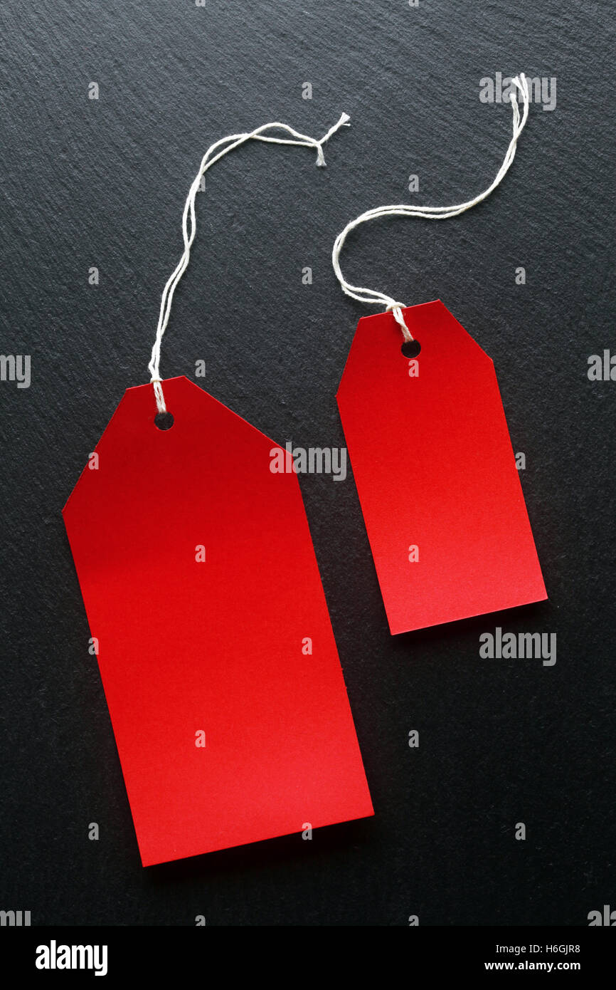Blank price tags on dark background Stock Photo - Alamy