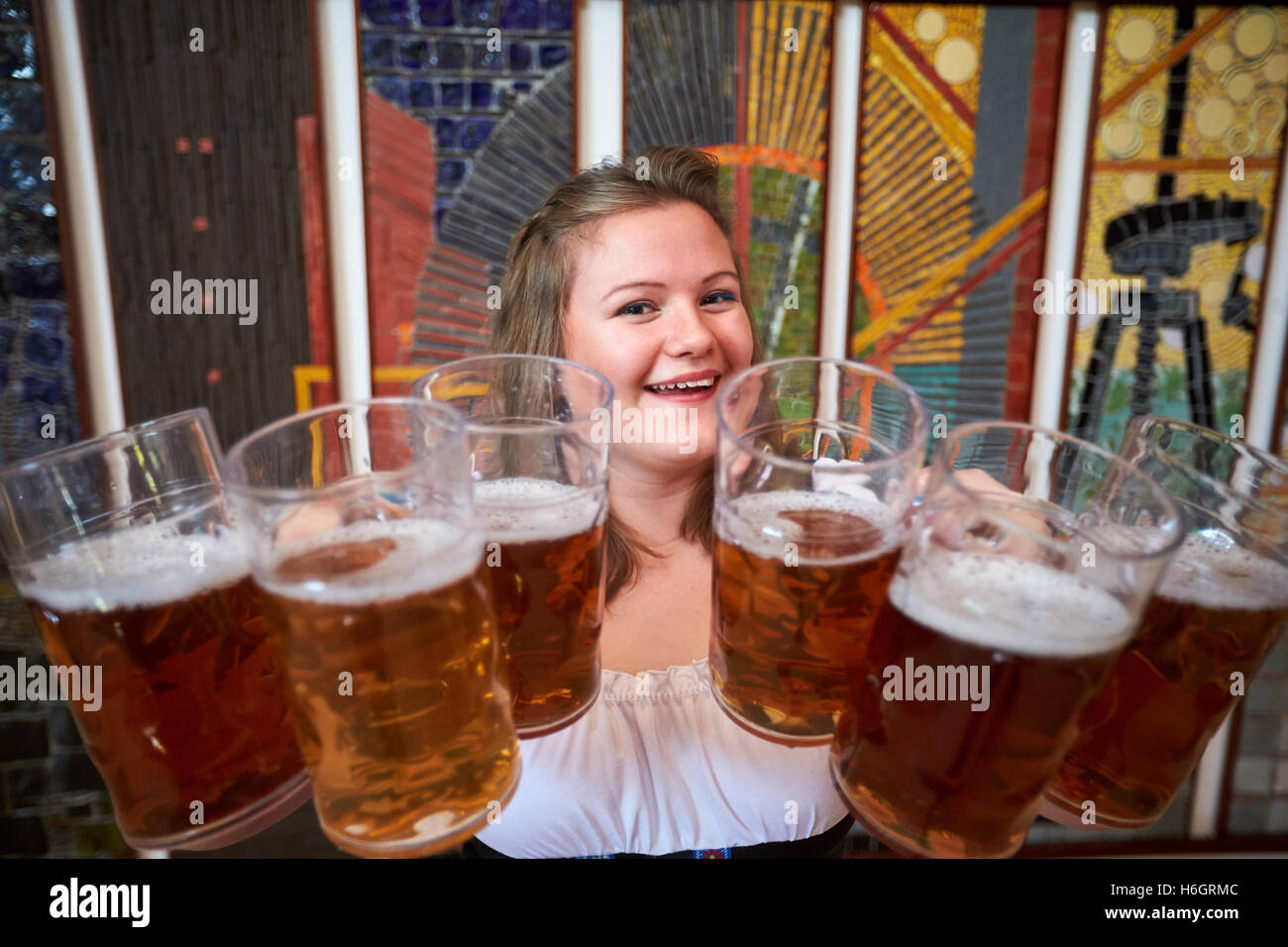 Waitress carrying beer steins hires stock photography and images Alamy