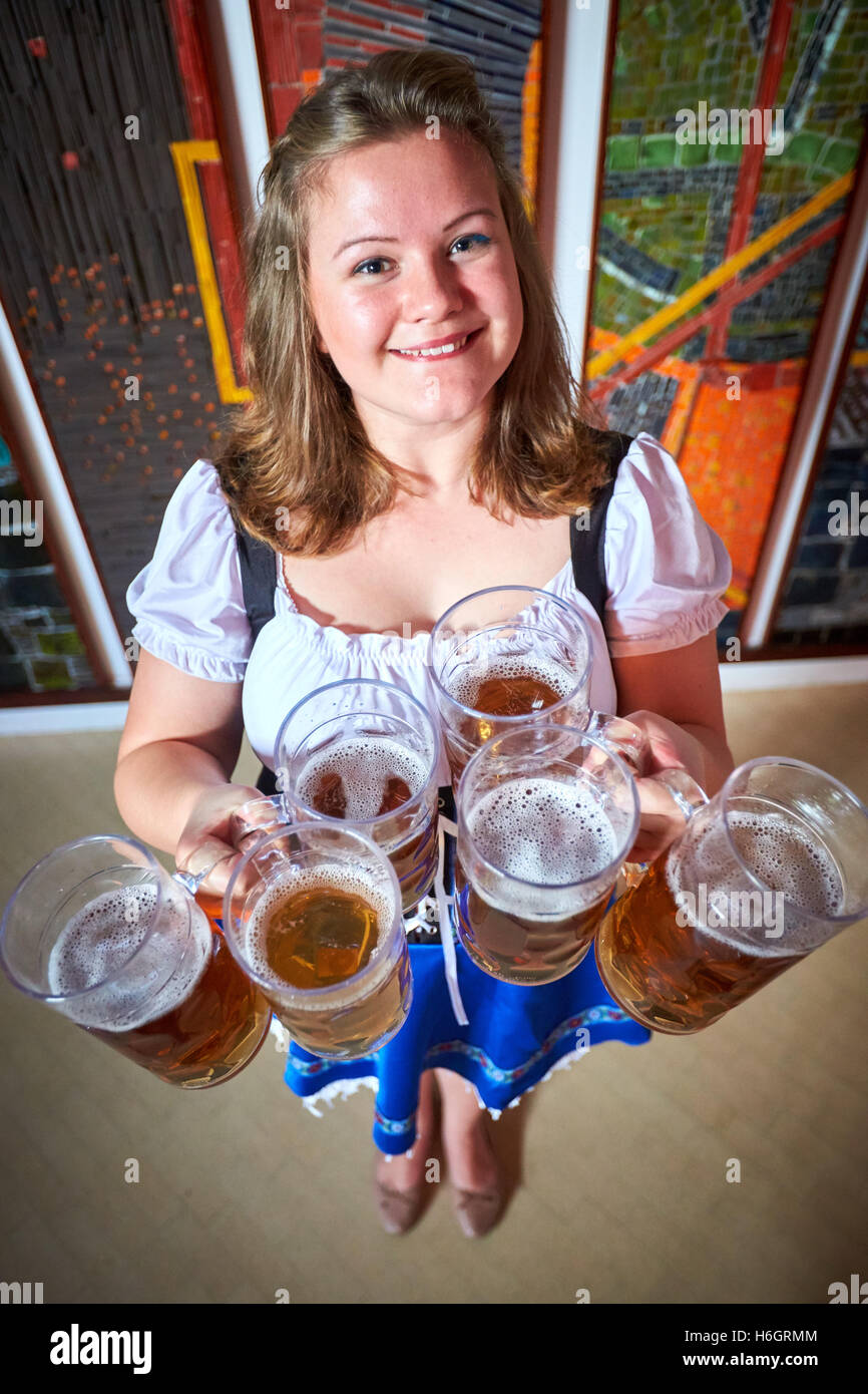 Waitress carrying beer steins hi-res stock photography and images - Alamy