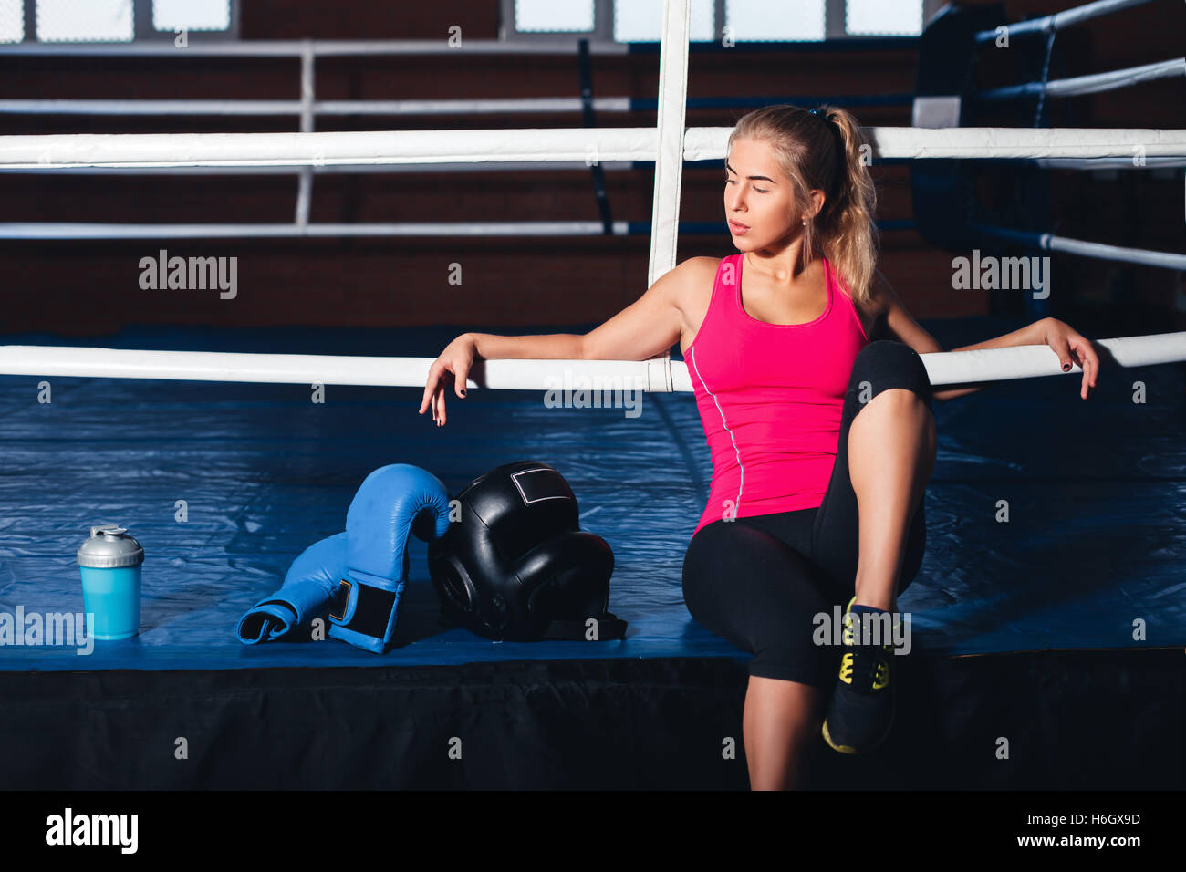 Woman sitting on the boxing ring Stock Photo Alamy