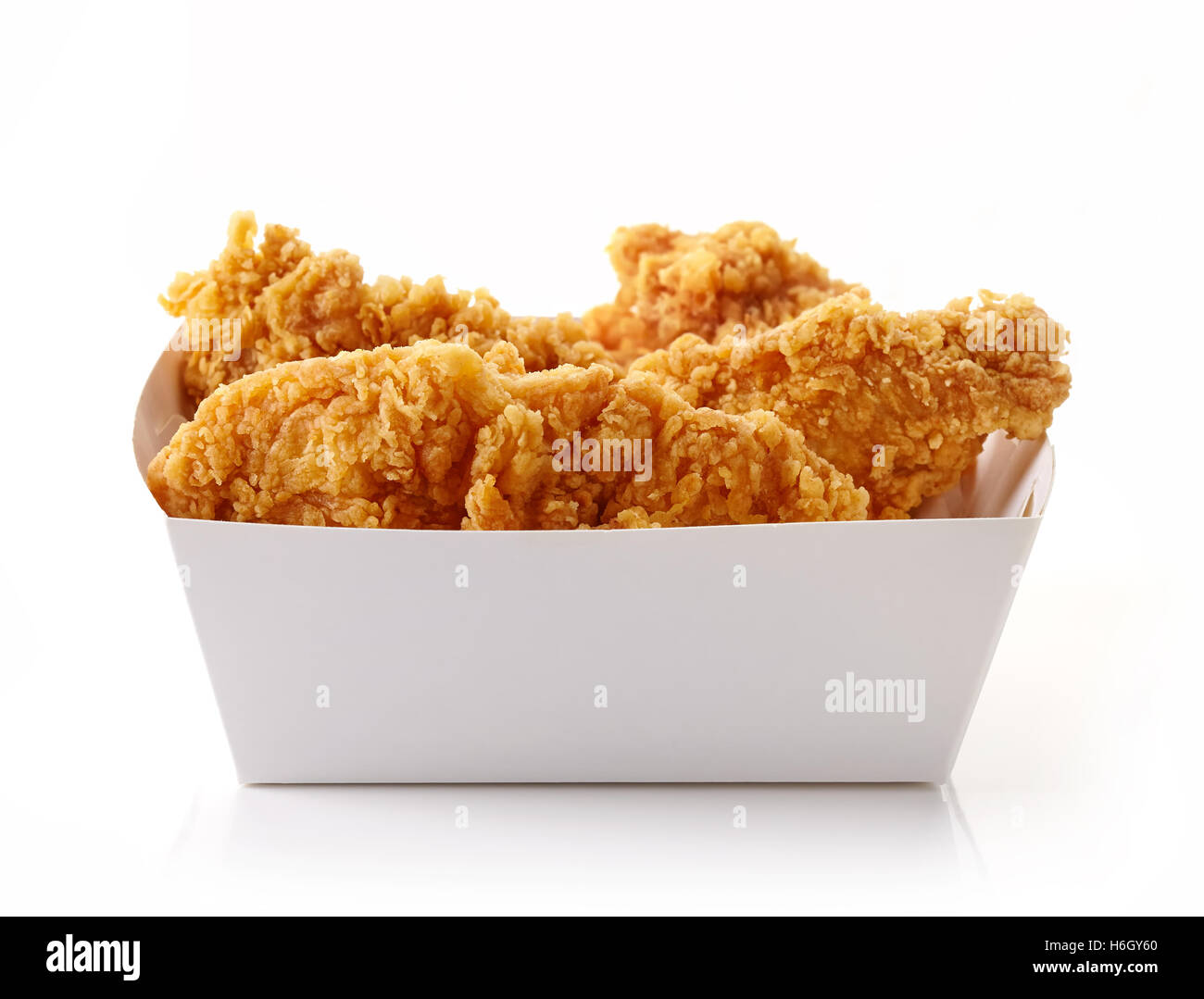 Fried breaded chicken fillet in white cardboard box isolated on white background Stock Photo