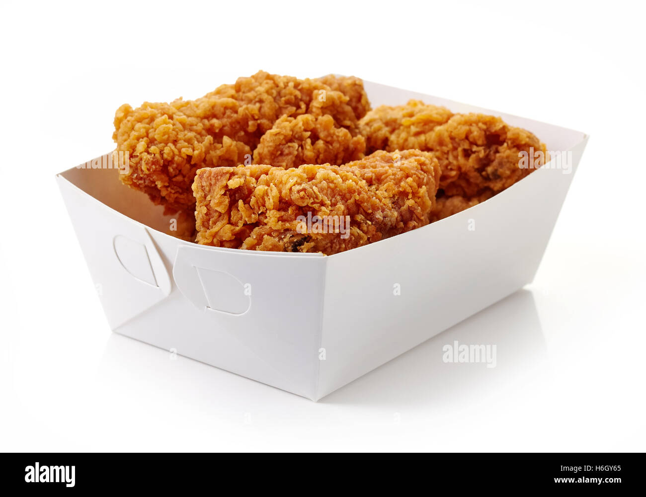 Fried breaded chicken wings in white cardbord box isolated on white background Stock Photo