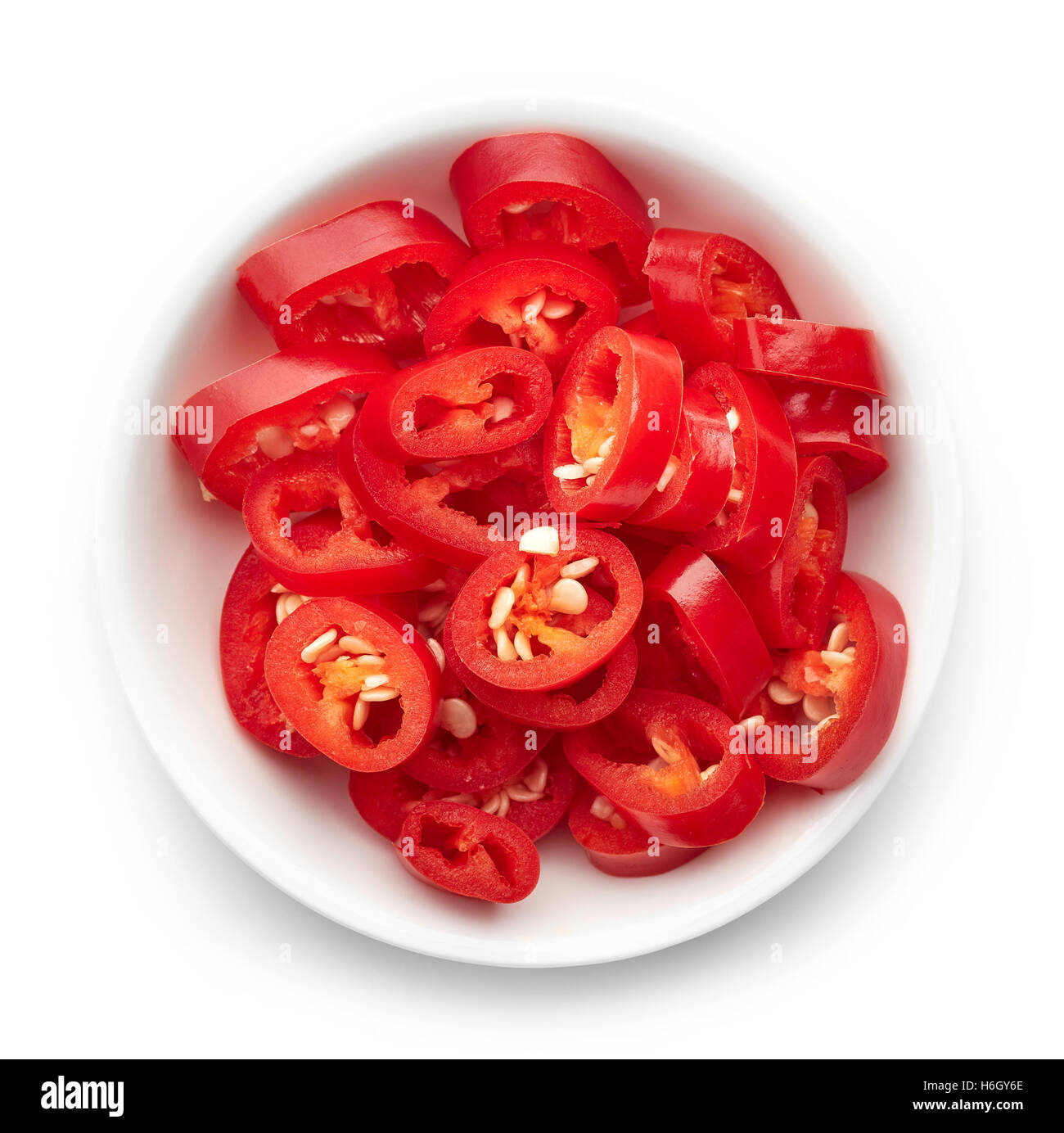 Bowl of red hot chili pepper isolated on white background, top view Stock Photo