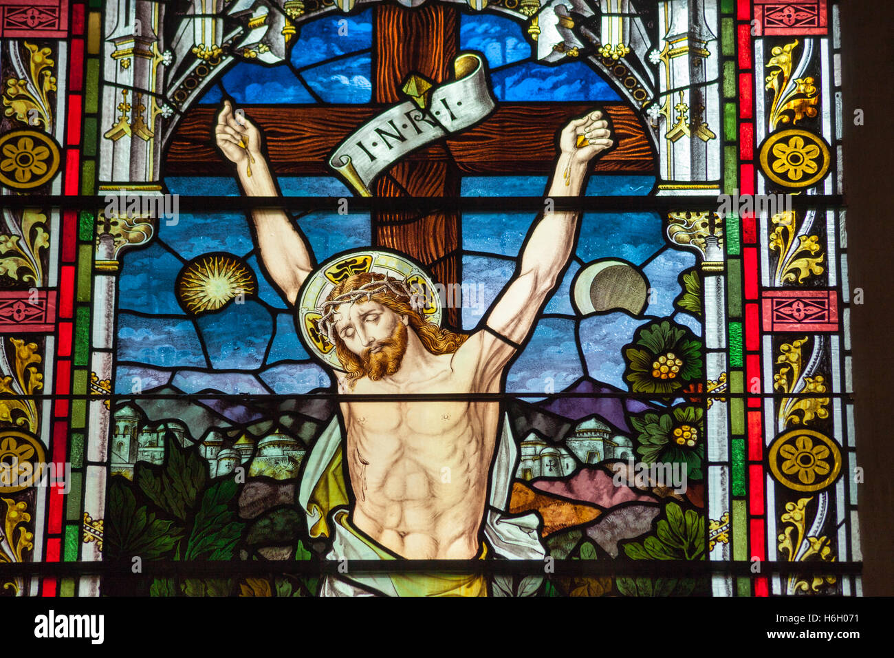 Stained glass window of Christ’s crucifixion, Oslo Domkirke, Oslo Cathedral, Oslo, Norway Stock Photo